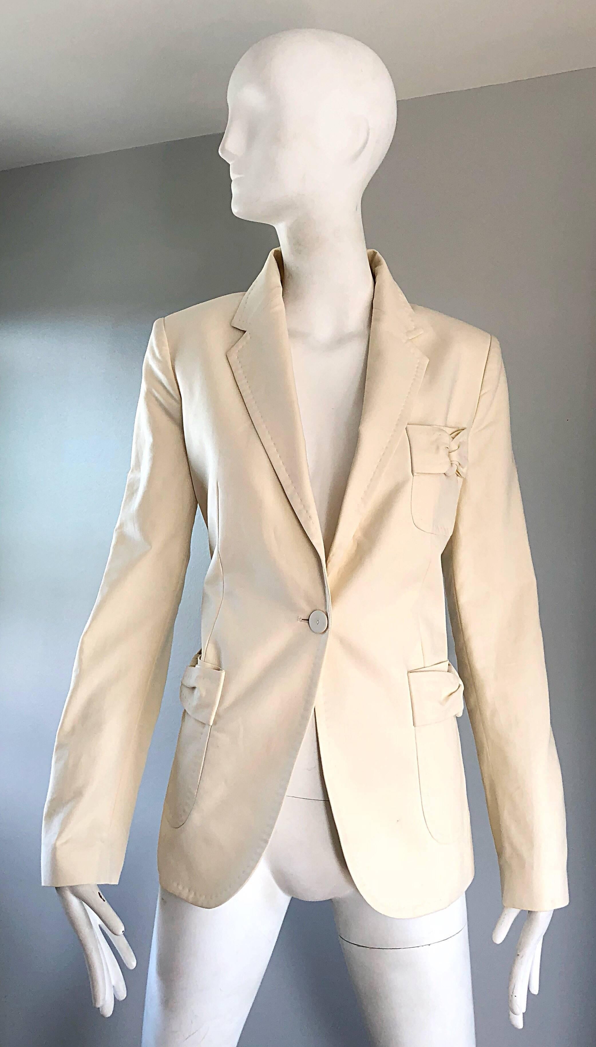 Chic brand new vintage 1990s VIKTOR and ROLF ivory cotton blazer jacket! Features a smart tailored fit, with Avant Garde 'loops' on each waist pocket, and on the breast pocket. Single button closure. Fully lined, with interior pockets. Great fit,