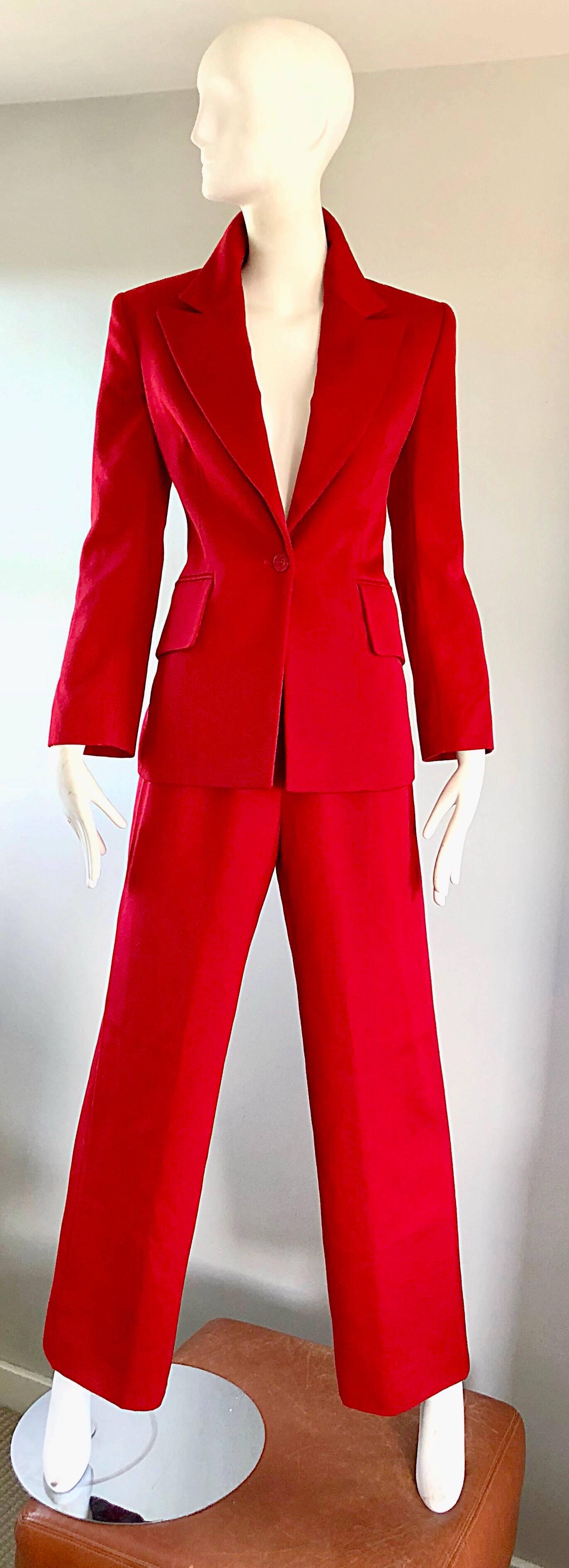 Wonderful early 90s ISAAC MIZRAHI lipstick red wool (Woolmark) wide leg tailored le smoking trouser suit! Features a smart tailored one button blazer, with wide collar lapels. Pocket at each side of the waist. Vent at back hem. Chic wide leg high