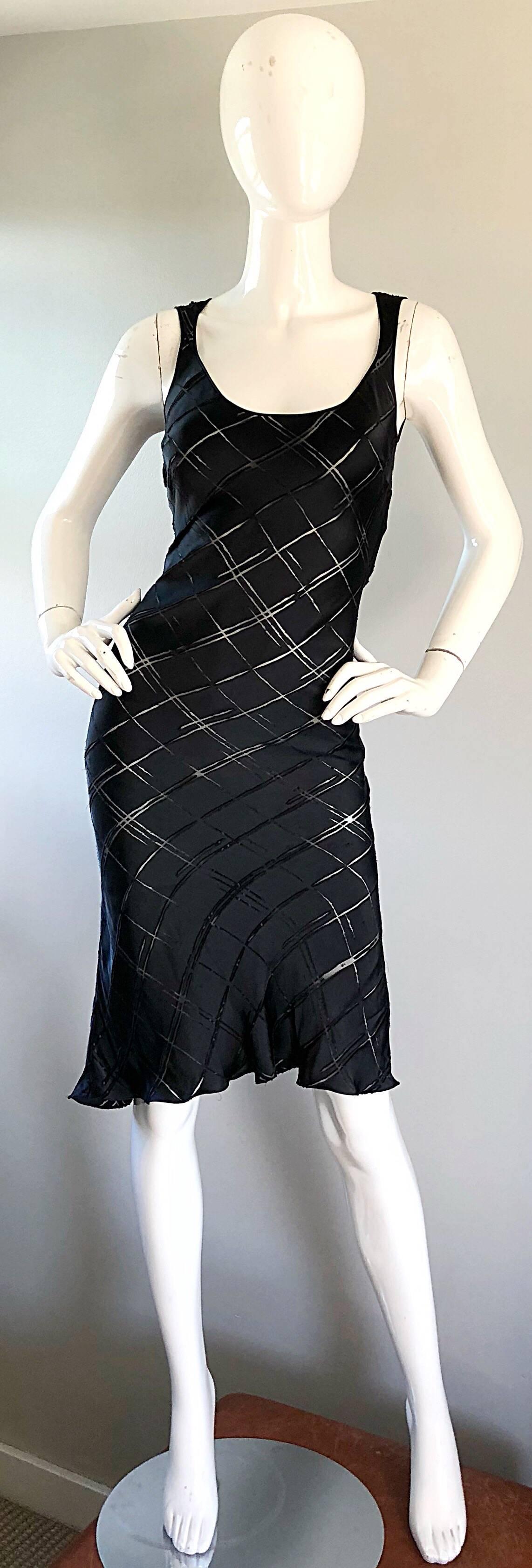 Sexy early 90s vintage JOHN GALLIANO black silk cut-out bias cut slinky slip dress! Features luxurious Italian black silk, with nude chiffon slits throughout. Please note that panels are sheer, not white (looks white because of mannequin).  Simply