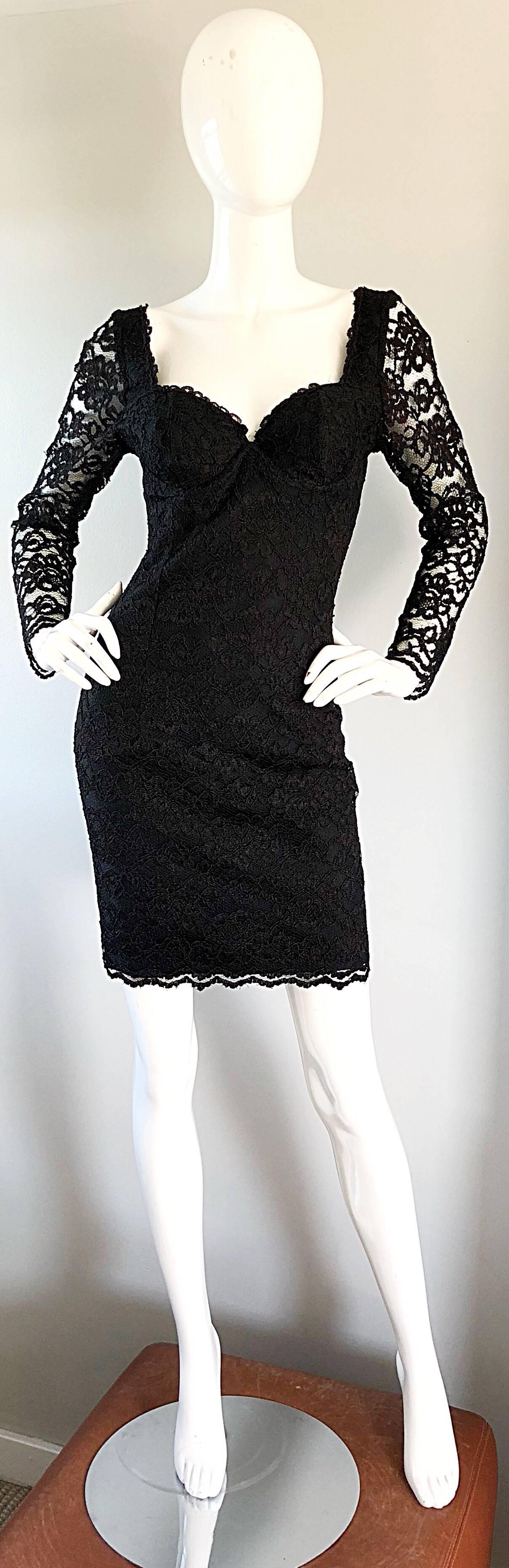 Perfect sexy vintage 90s black silk and crepe fully French Lace bodcon long sleeve little black mini dress! Features a fabulous body hugging fit. Interior boned corset bodice keeps everything in place. Sweetheart neckline, and form fitting skirt.