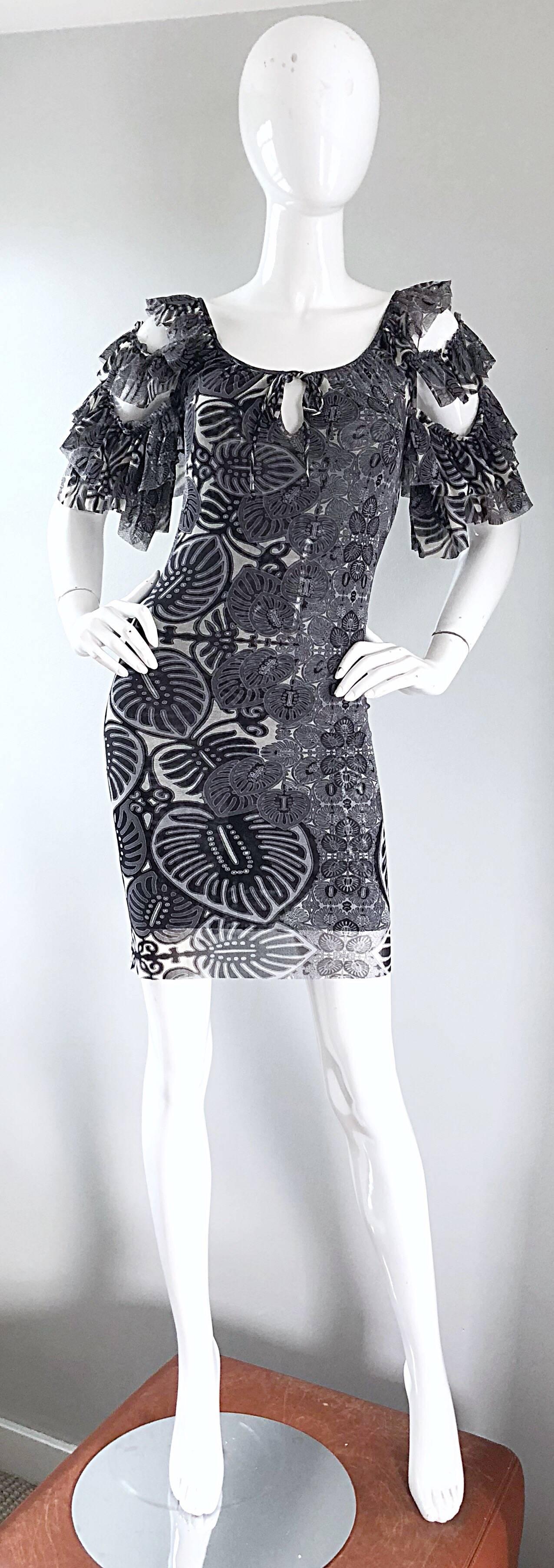Sexy 90s JEAN PAUL GAULTIER black, white and grey flamenco style cold shoulder mini dress! Features multiple layers of signature JPG mesh that stretches to fit. Banana leaves and batik prints throughout. Simply slips over the head. Features three