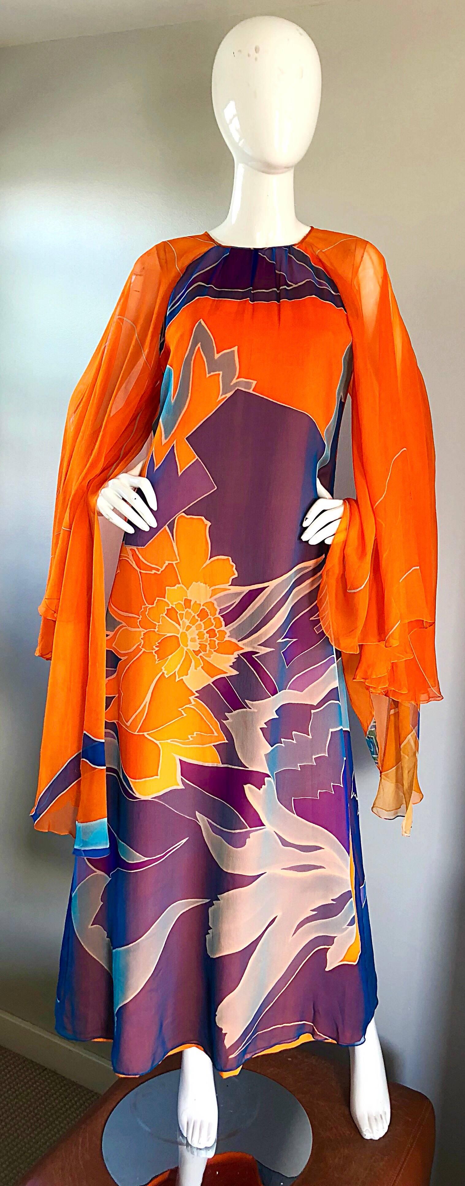 Sensational vintage 70s HANAE MORI COUTURE bright orange silk chiffon kaftan maxi dress! Features incredible dramatic wide angel wing sleeves, with layers and layers of semi sheer chiffon. Vibrant abstract prints in bright orange, purple, blue,