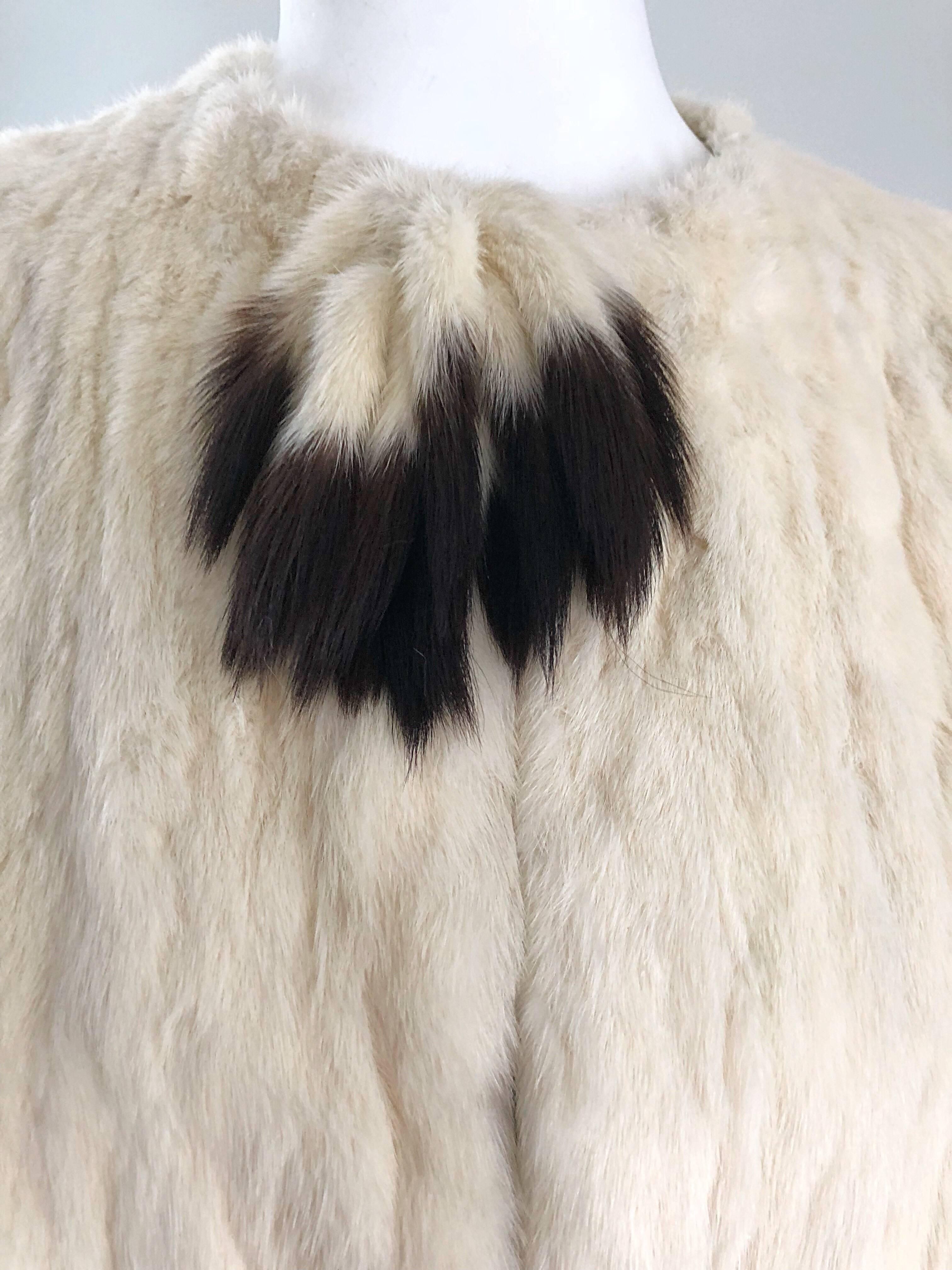 Luxurious late 30s Ermine fur soft jacket coat! Ermine is one of the softest furs out there, and was known to be worn by kings and queens since the 15th century. Couture workm with fur hook-and-eye closure up the top front. Extremely warm, and cozy,