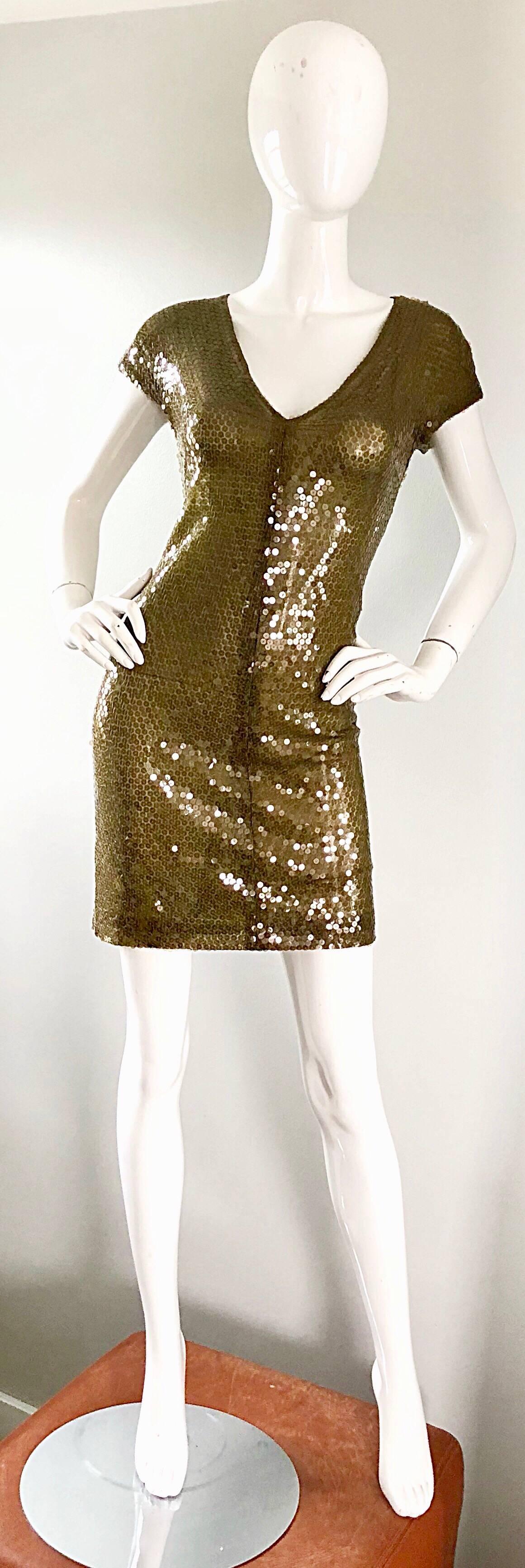 Sexy vintage early 1990s KRIZIA hunter green silk sequined semi sheer mini dress! Features thousands of hand-sewn deep green sequins on double layered silk net. Simply slips over the head, and stretches to fit. Can easily be dressed up or down, and