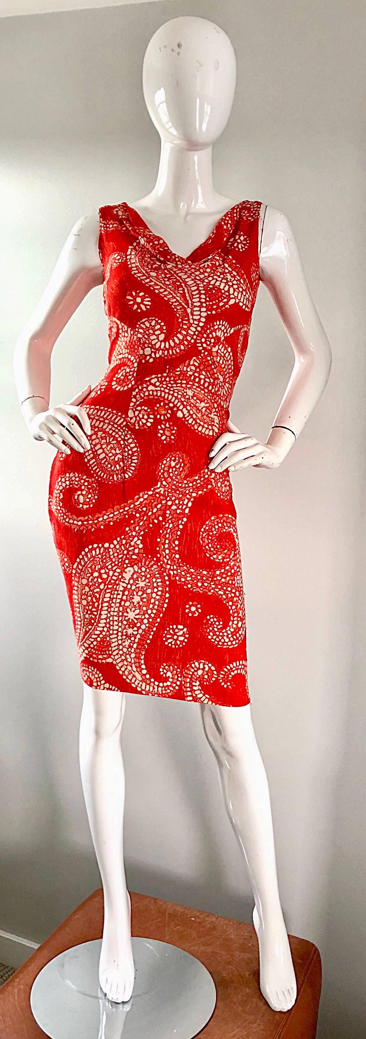 Beautiful late 1950s BONWIT TELLER Irish linen wiggle dress! Features an exaggerated paisley print throughout in Burt orange and ivory. Pockets at each side of the hips. Draped neck allows for some give in the bust area. Full metal zipper up the