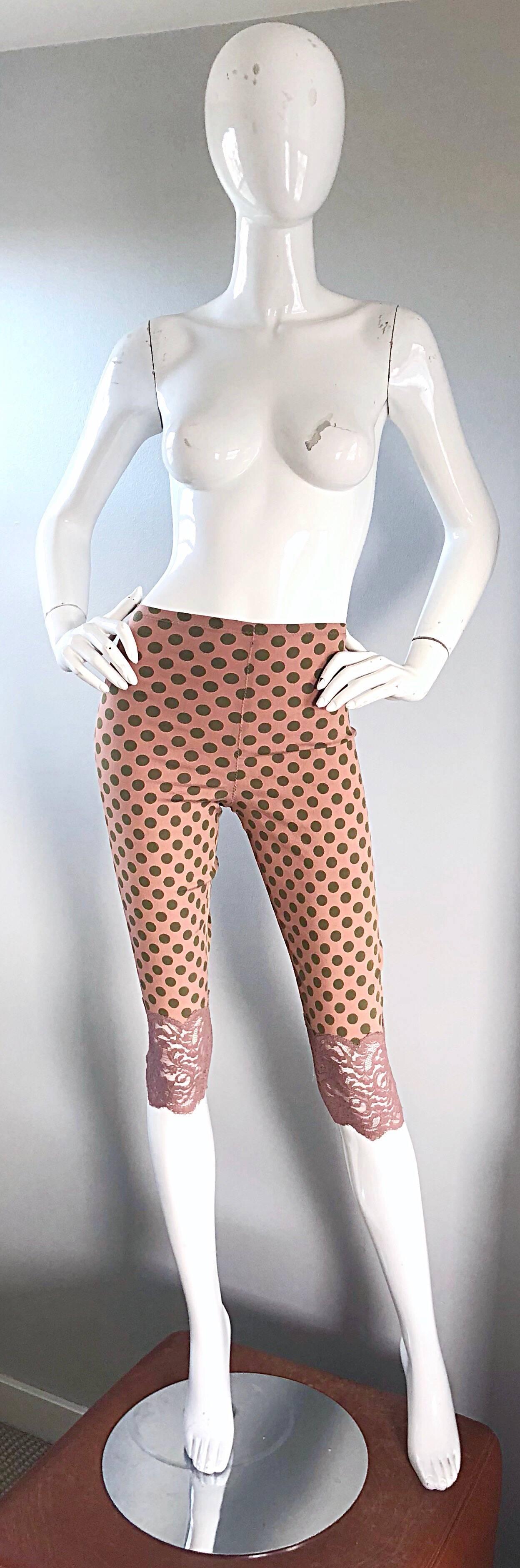 Amazing vintage JEAN PAUL GAULTIER salmon pink and olive green polka dote cropped capri pants! Features a soft cotton/rayon blend that stretches to fit. Unique pink lace hem. Can easily be dressed up or down. In great unworn condition. 
Made in