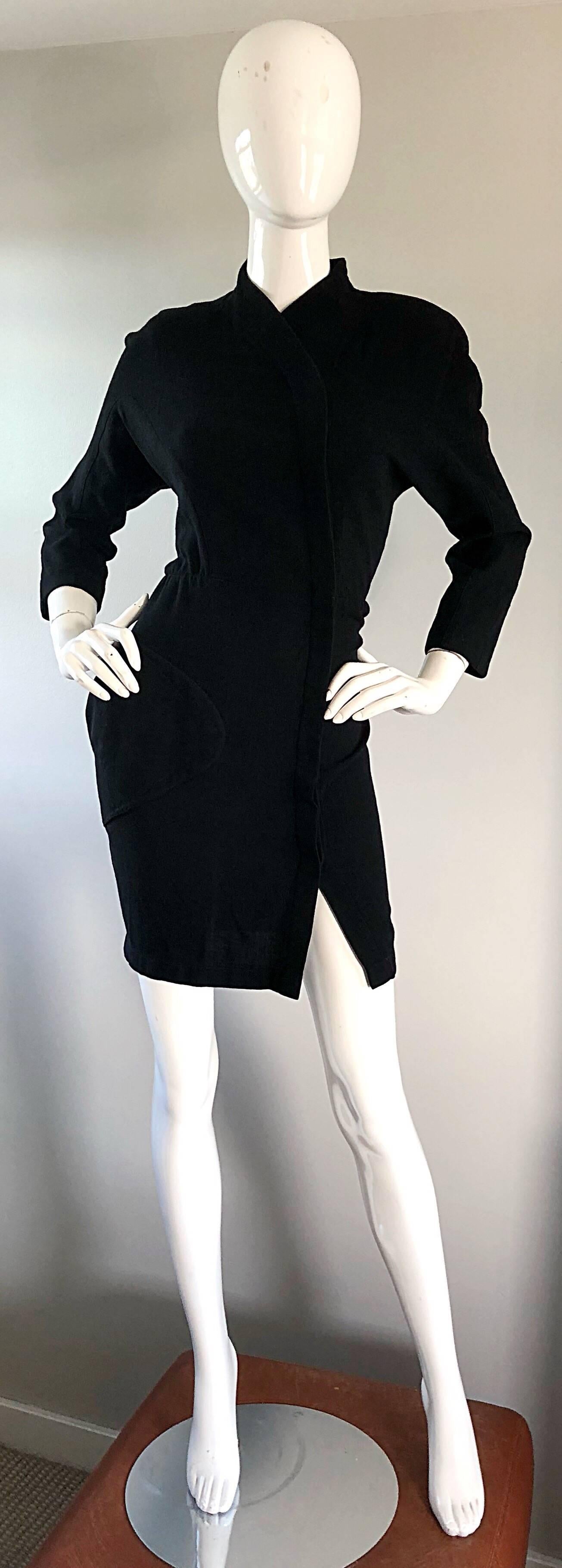 Sexy early 1990s THIERRY MUGLER black wool Asian / kimono inspired mini dress! Features hidden snaps up the entire front. Avant Garde signature pocket at right waist. Chic 3/4 sleeves are perfect for fall and winter. Forgiving dolman sleeves allow