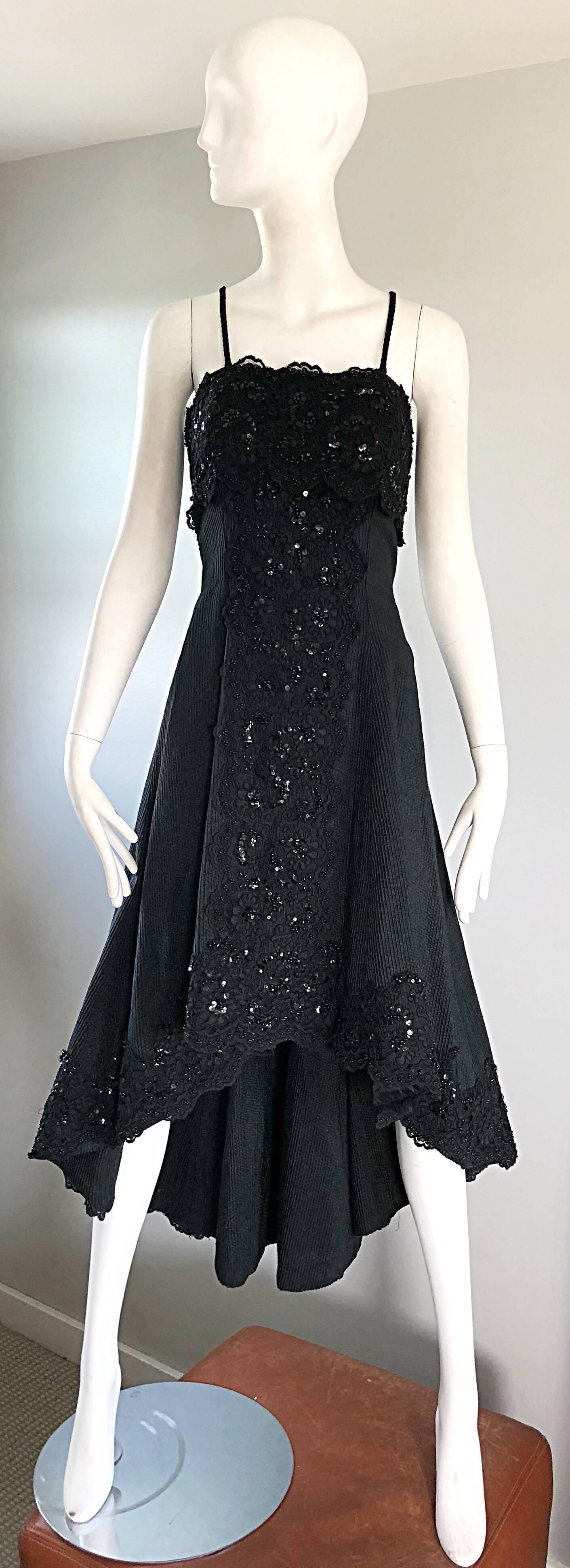 Beautiful 1990s does 1950s demi couture black silk dress! Features a fitted bodice, with a flared high-low skirt. Hundreds of hand-sewn sequins and beads mixed with lave throughout. Boned bodice keeps everything properly in place. Hidden zipper up