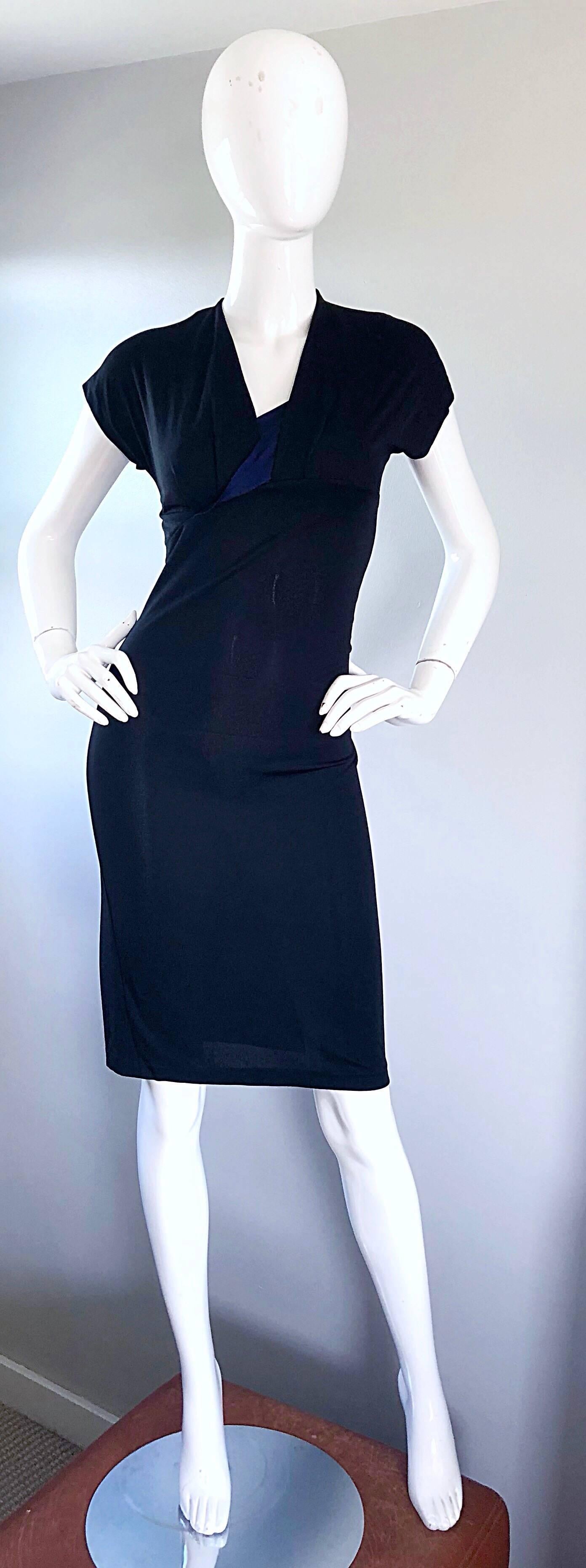 The perfect little black dress! This 1990s SALVATORE FERRAGOMO black and navy blue jersey dress is an easy winner! Features soft rayon jersey fabric that stretches to fit. Navy blue silk detail at center bust. There is so much attention to detail,