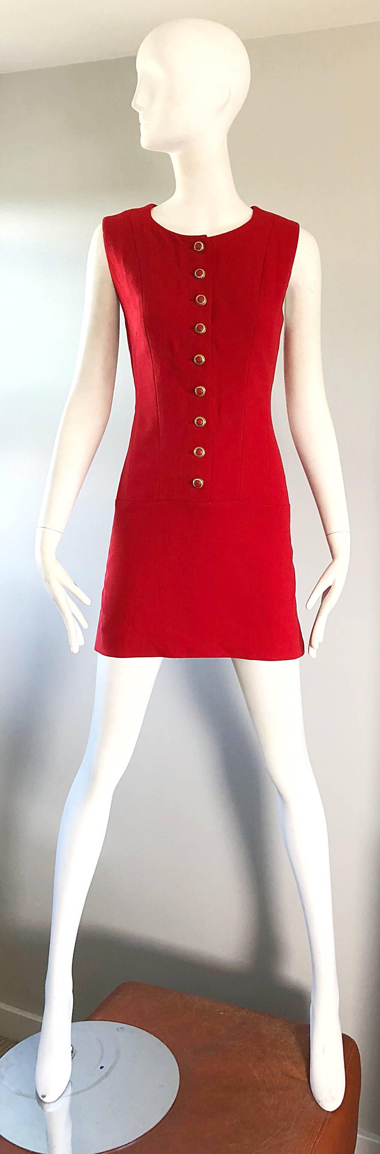 Chic 90s does 60s KARL LAGERFELD lipstick red virgin wool mod mini shift dress! Features soft virgin wool that is completely lined. Red and gold buttons up the front, with hidden zipper up the back and hook-and-eye closure. 1960s shift style.
