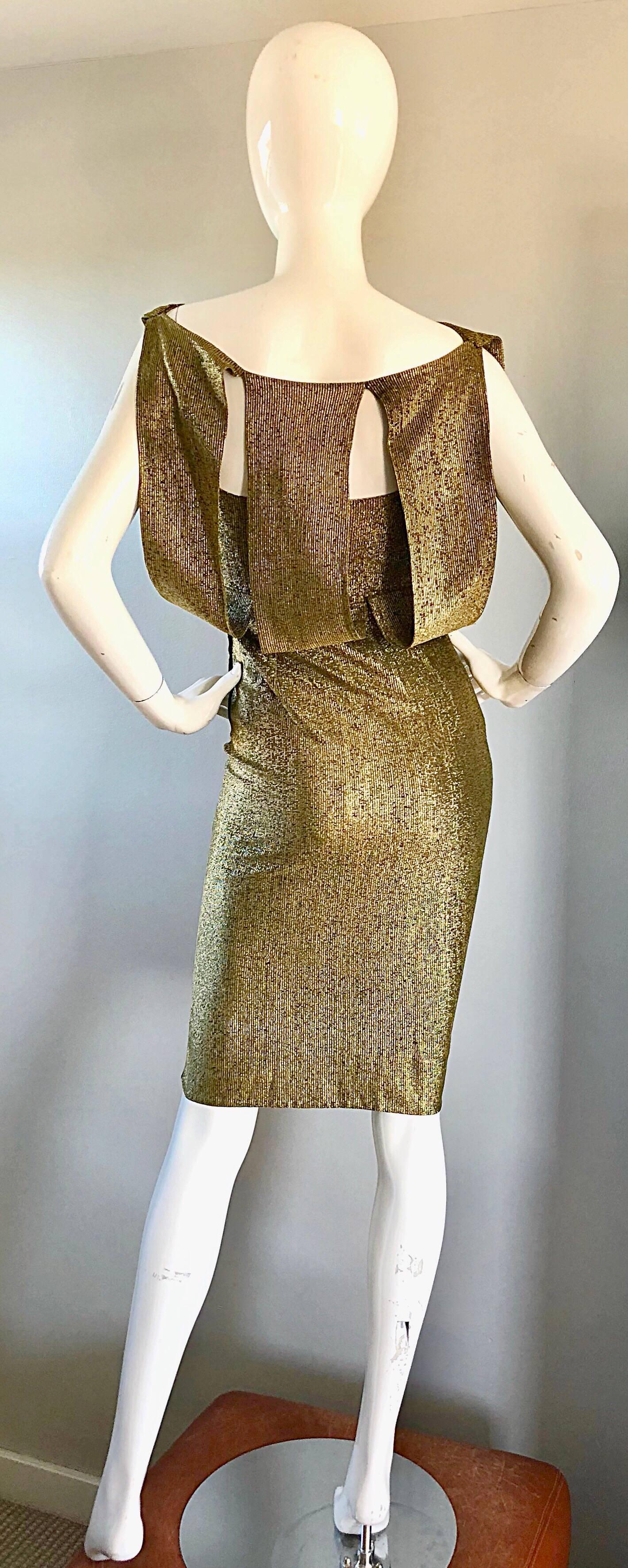 Gorgeous 1950s gold metallic silk Avant Garde cut-out back demi couture wiggle dress! Features a form fitting fit. Cut-outs on the back reveals just the right amount of skin. Dramatic sleeveless lines. Hidden zipper up the side with hook-and-eye