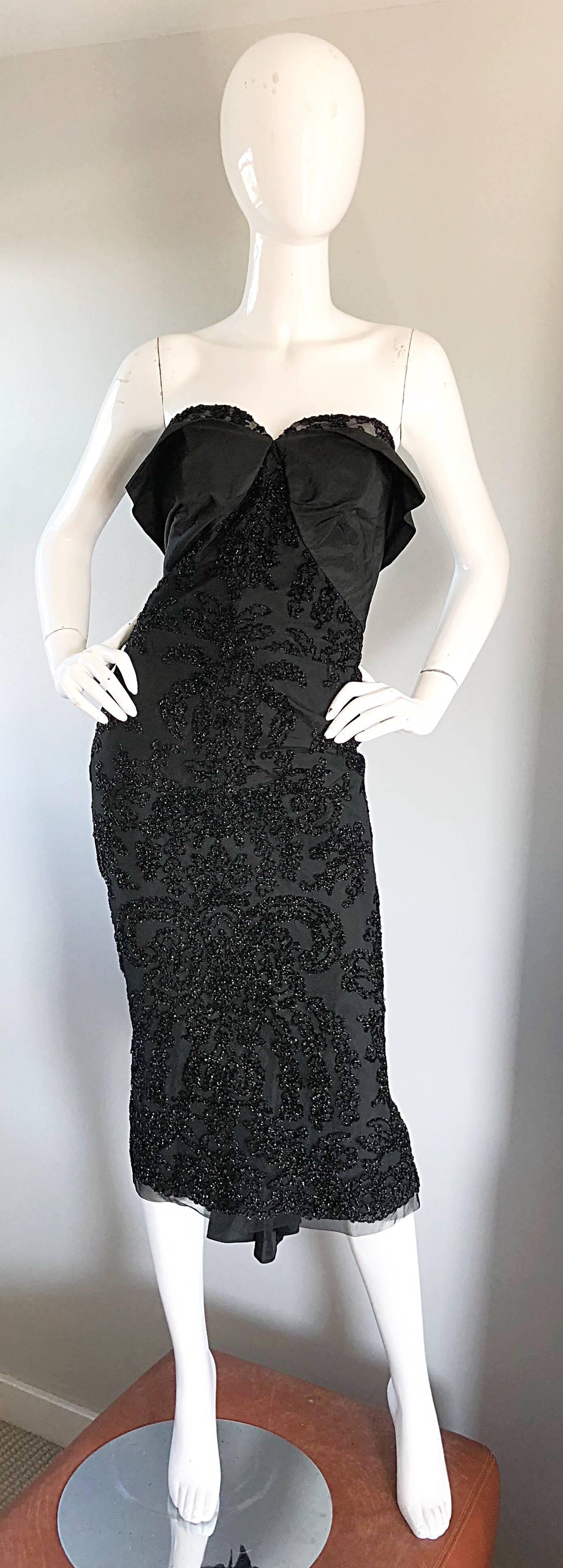 Stunning 1950s vintage couture black silk metallic strapless wiggle dress, with taffeta train! Bombshell sexy 50s starlet silhouette! 
Features a taffeta boned shelf bodice with lace peeking above the bust. Figure hugging bodice is beyond