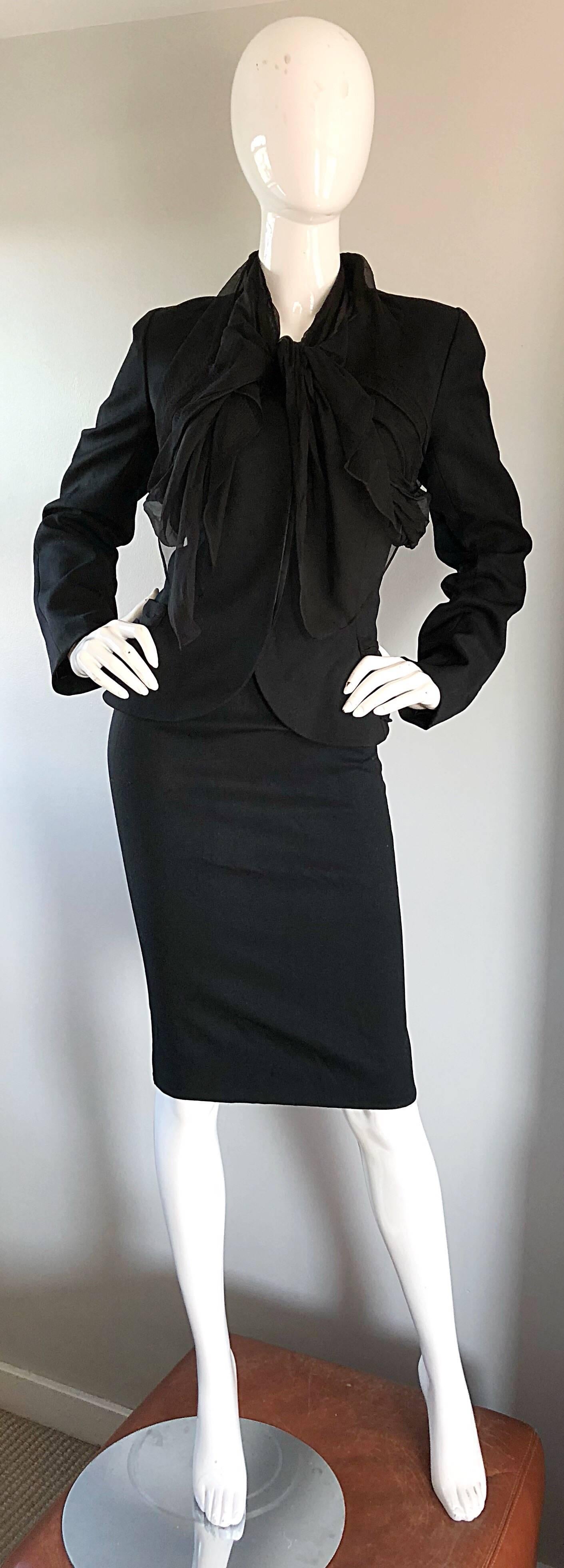 Chic early 2000s Does 40s black JOHN GALLIANO virgin wool and silk chiffon skirt suit! Features a soft black virgin wool, with Avant Garde black silk chiffon Bonnie and Clyde detail at neck and waist. Hidden buttons up the front blazer bodice. High