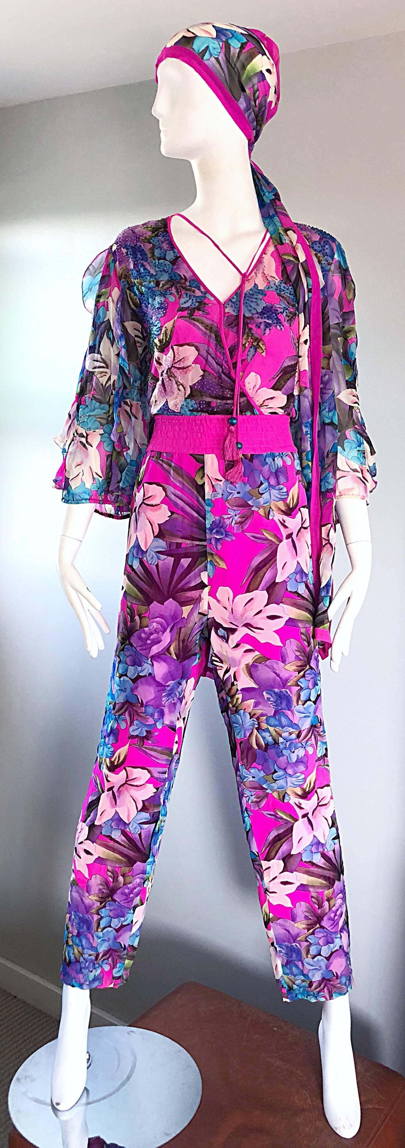 Amazing vintage DIANE FREIS silk chiffon beaded jumpsuit! Features vibrant colors of pink, purple and blue in a chic floral print throughout. Hundreds of hand-sewn seed beads on the bodice. Inner hidden snap at bust allows to control cleavage