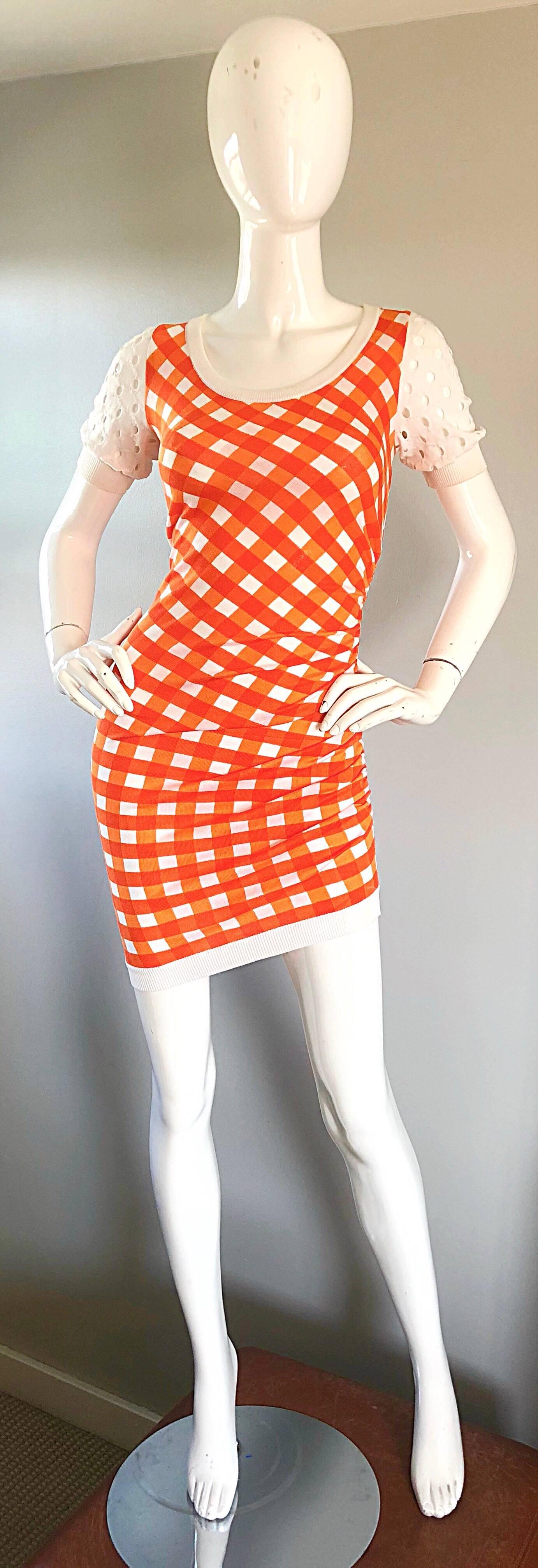 Sexy vintage 90s MOSCHINO CHEAP AND CHIC orange and white gingham asymmetrical bodcon dress! Features a vibrant orange, mixed with white. Short sleeves features perforated cut-outs on each sleeve. Asymmetrical hem, with gathers up the left side.