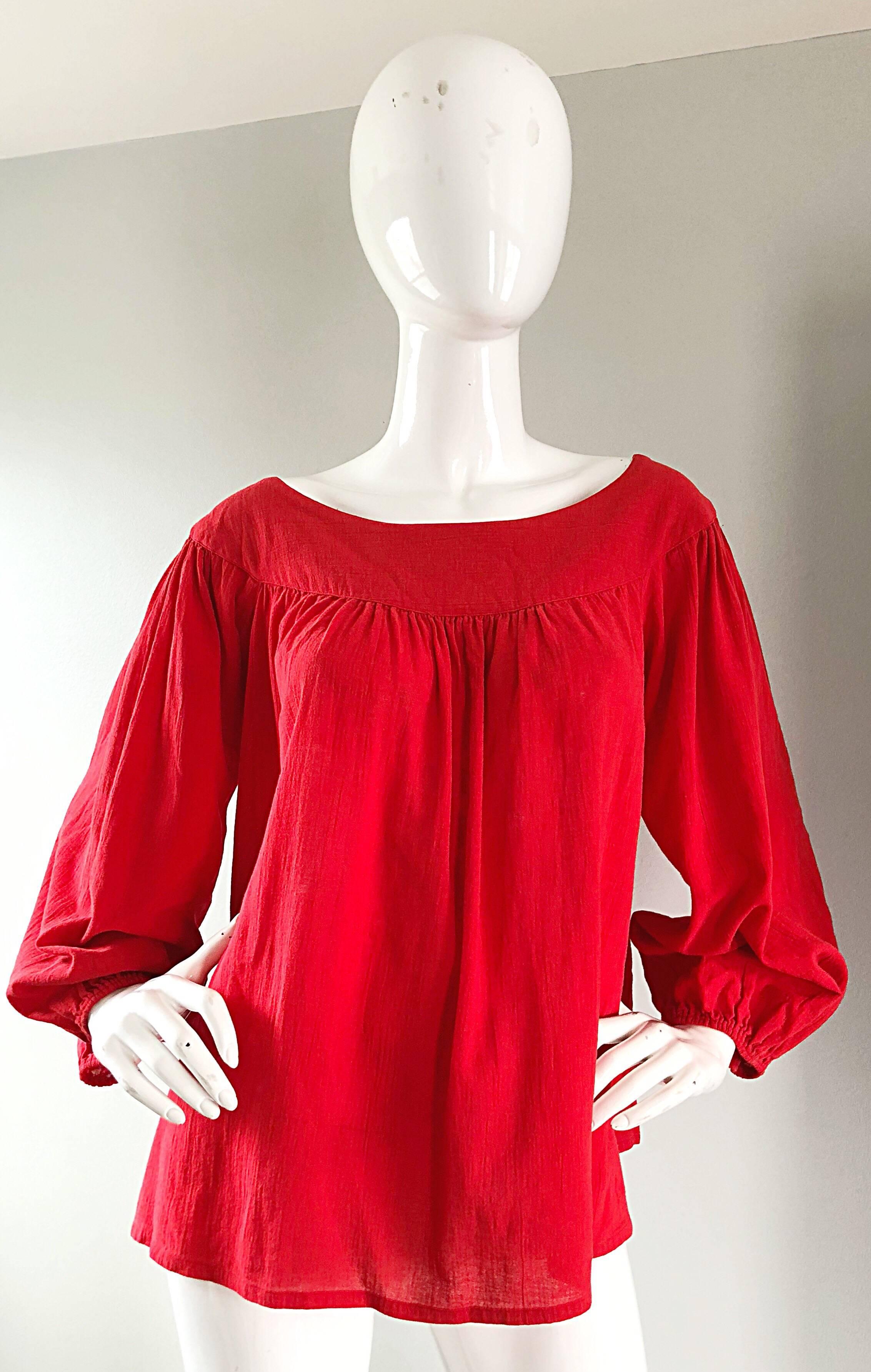 Rare and collectible vintage 70s YSL Rive Gauche cotton peasant shirt from the infamous 1976 RUSSIAN COLLECTION! Features a lightweight textured cotton that looks fantastic on! Boat neck, with a forgiving trapeze empire waist. Elastic cuffs at each