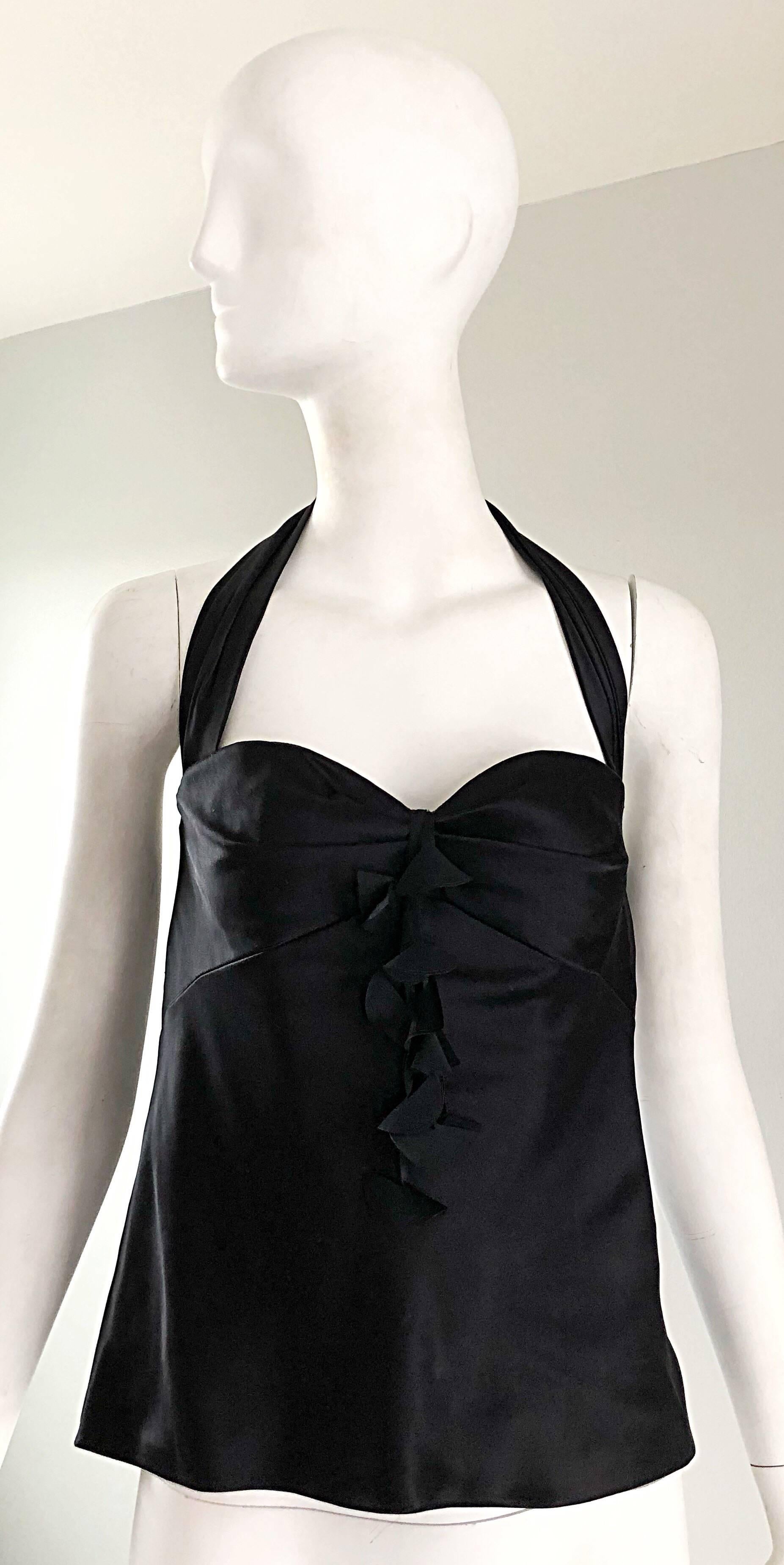 Sexy 1990s JACKIER ROGERS black silk halter top! Features the finest luxurious silk that is super soft to the skin. Attached 
'Pom Pom' details dangle at the center bust. Full zipper up the back, with the lower back partially exposed. Great with