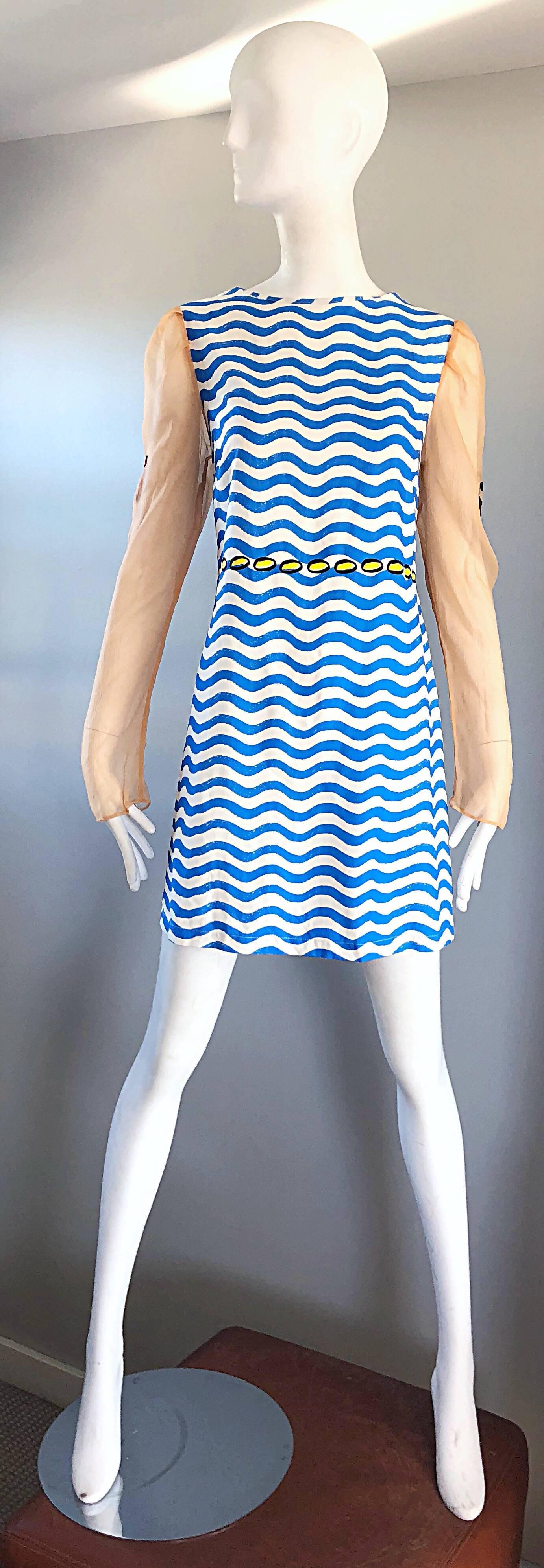 Rare and limited edition THE RODNIK BAND novelty nautical silk dress! Features blue and white squiggly stripes on the body of the dress, with yellow polka dots directly above the waist. Nude silk chiffon sleeves features trompe l'oeil tattoo prints