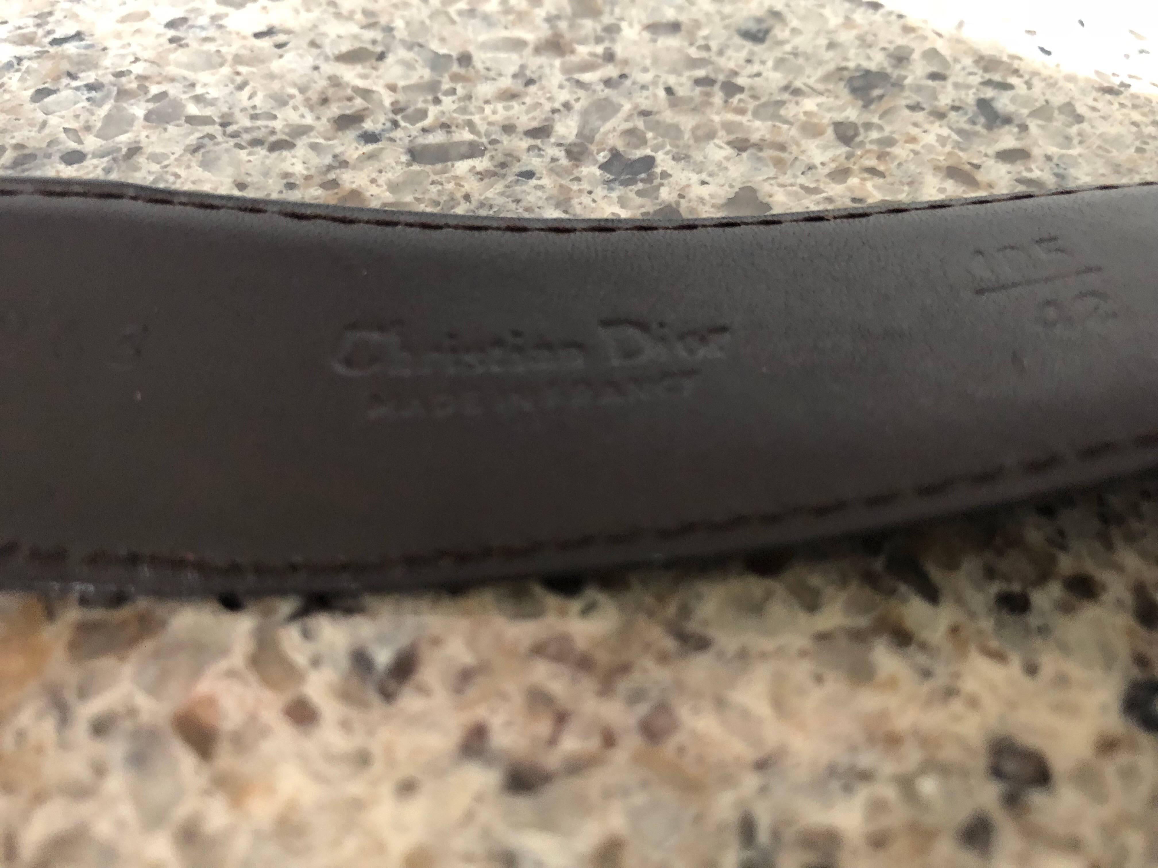 Awesome vintage CHRISTIAN DIOR 1970s men's reversible black and brown leather belt! Features the classic gold and silver two-tone buckle with the Dior logo. Perfect for traveling, and easily flips from black to brown. Great with jeans, shorts,