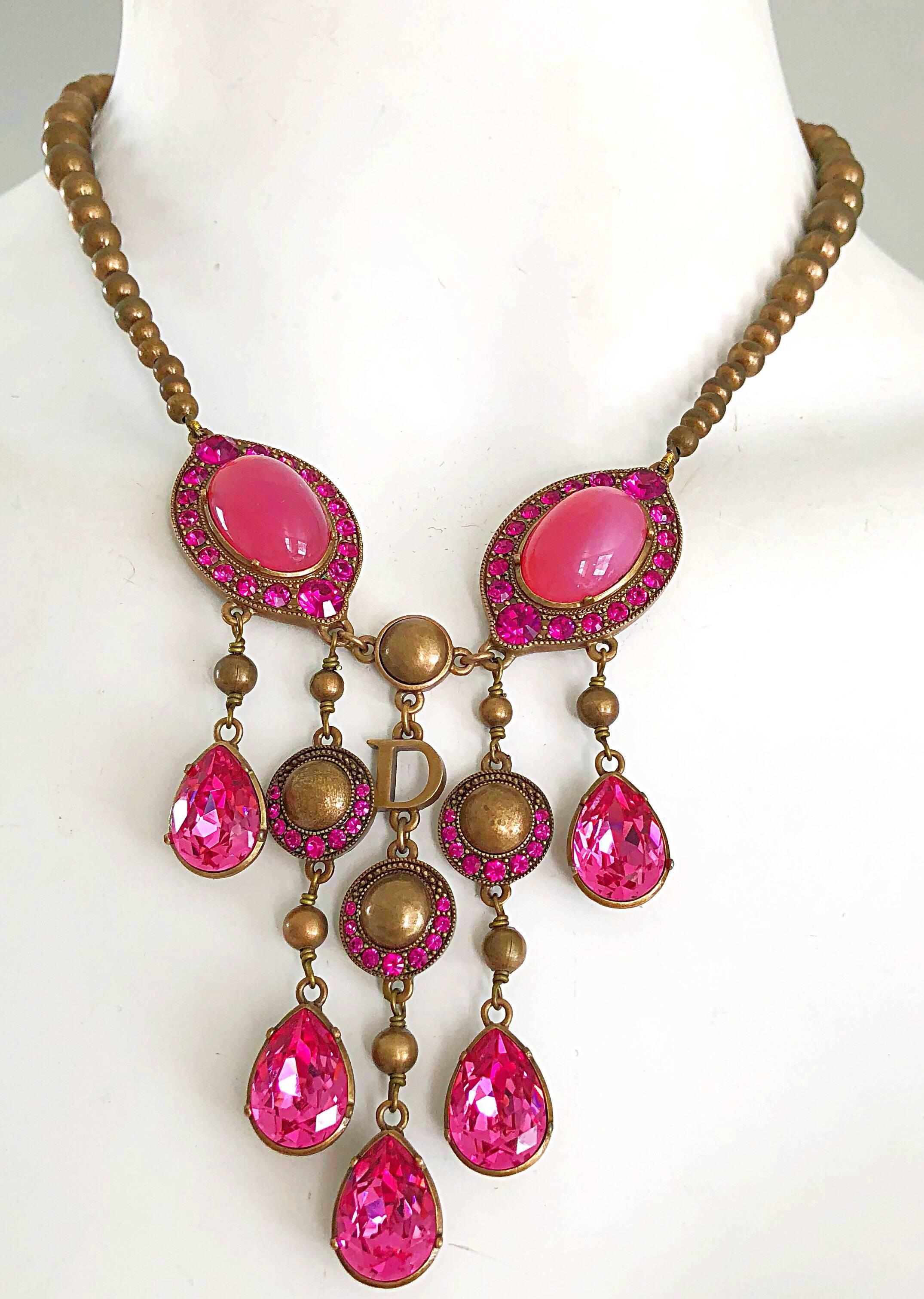 Stunning CHRISTIAN DIOR hot pink rhinestone golden bronze necklace! Features two large pink stones on each side, with five strands that dangle. Adjustable length to make choker length or longer. Great with jeans, a dress or a gown. In great unworn