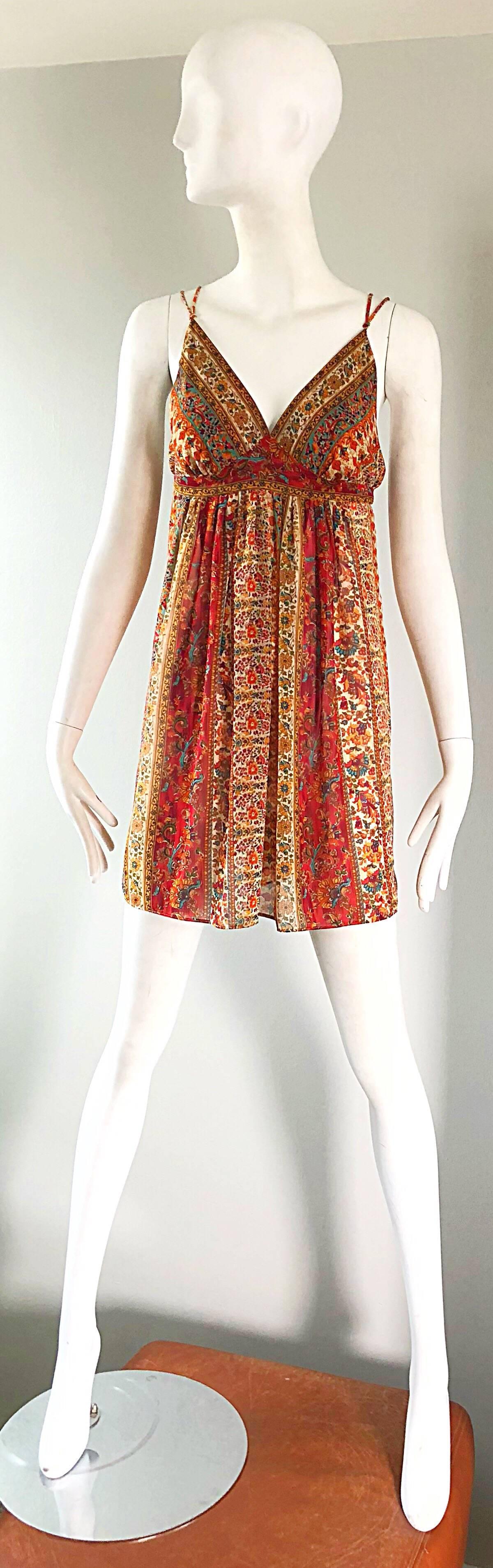 Go boho chic in this 90s OSCAR DE LA RENTA flower print empire waist spaghetti strap dress! Chic mini flower prints in warm tones of rust red, yellow, turquoise blue, orange and ivory throughout. Double spaghetti strap, Simply slips over the head.
