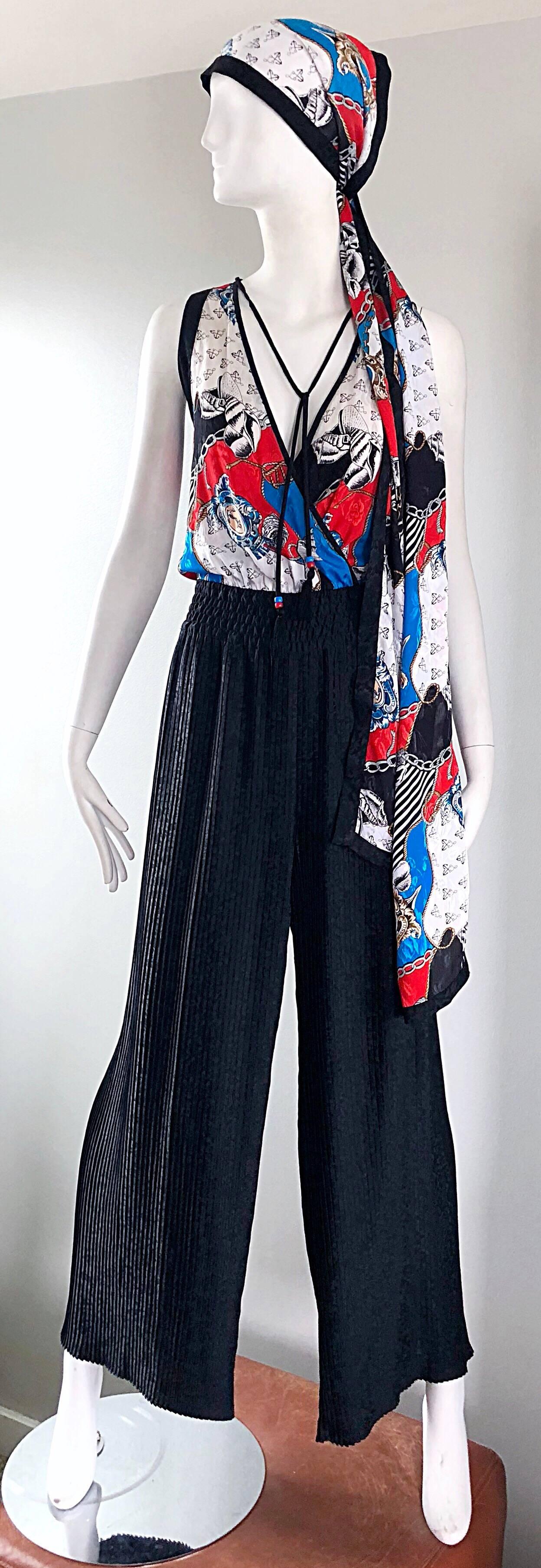 Amazing vintage DIANE FRIES nautical jumpsuit and headscarf / sash belt! Features a nautical print in red, white and blue, of anchors, sea shells, and rope throughout. Beaded tassels at each side of the neck can be tied, or left undone. Sash can