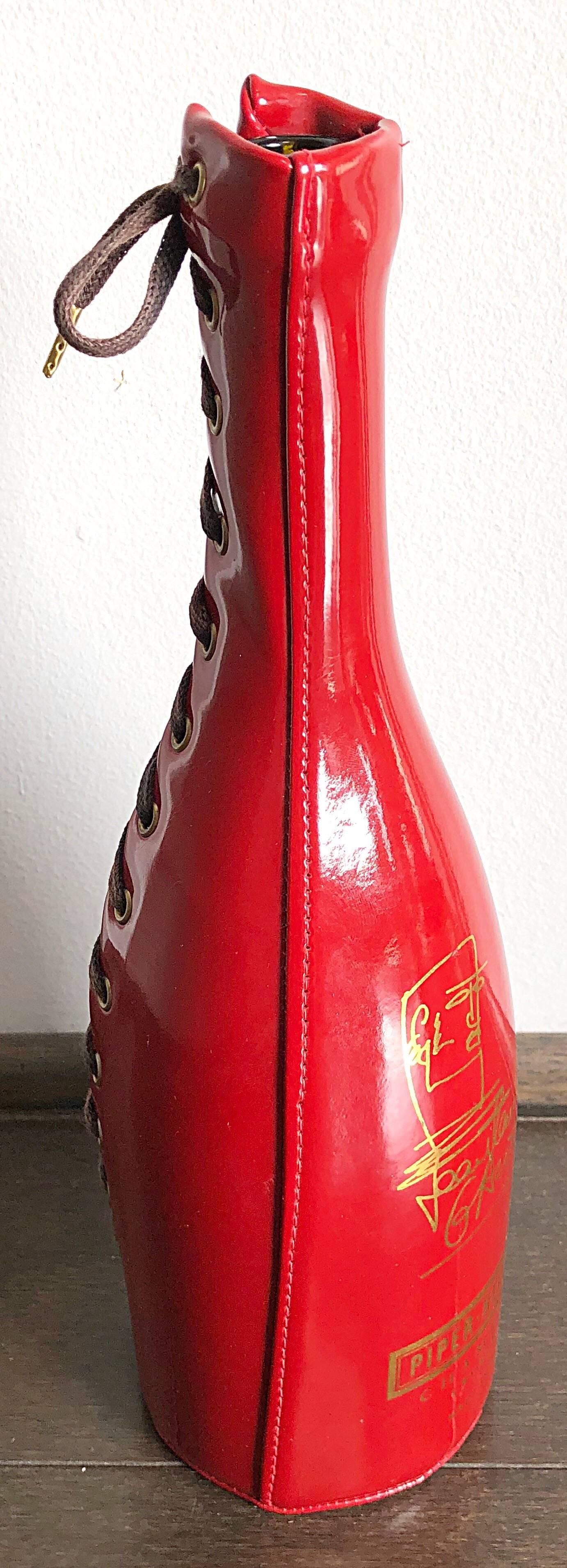 Rare late 90s JEAN PAUL GAULTIER for PIPER-HEIDSIECK red and gold vinyl corset champagne bottle, and holder. Limited edition series, that the designer created for the champagne brand in 1999. The perfect conversation piece for any interior designer.
