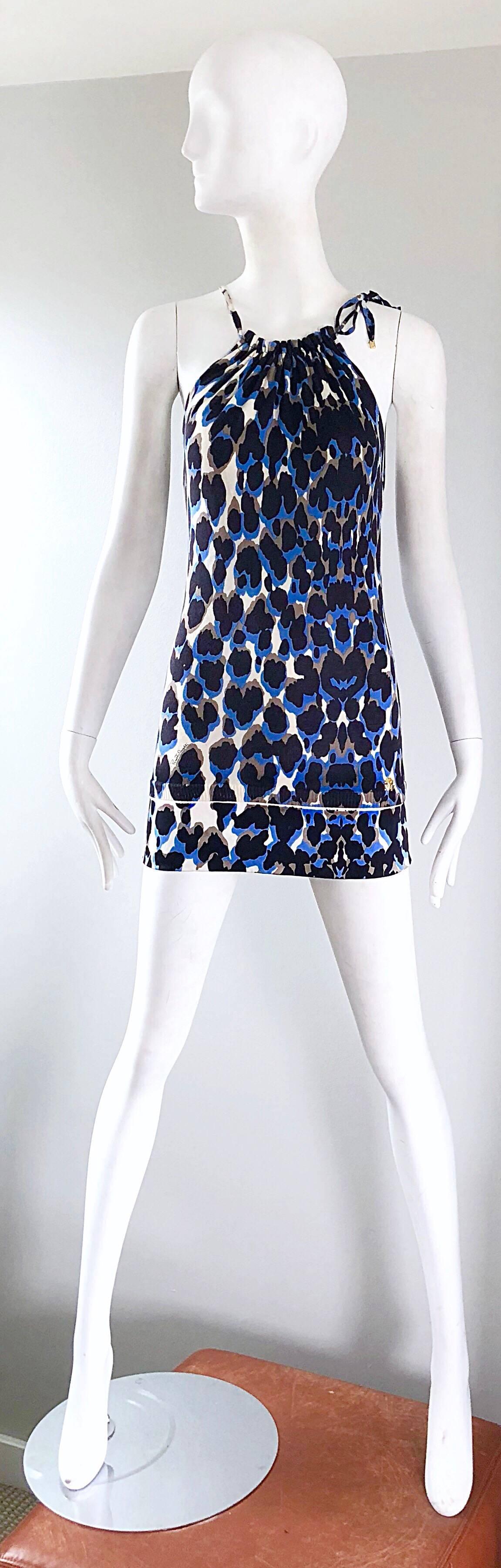 Sexy late 90s ROBERTO CAVALLI blue leopard cheetah print silk knit mini dress! Features a blue, brown, tan, ivory and black leopard print throughout. SIgnature gold Cavalli logo throughout, and a gold signature at left hem. Ties at left shoulder to