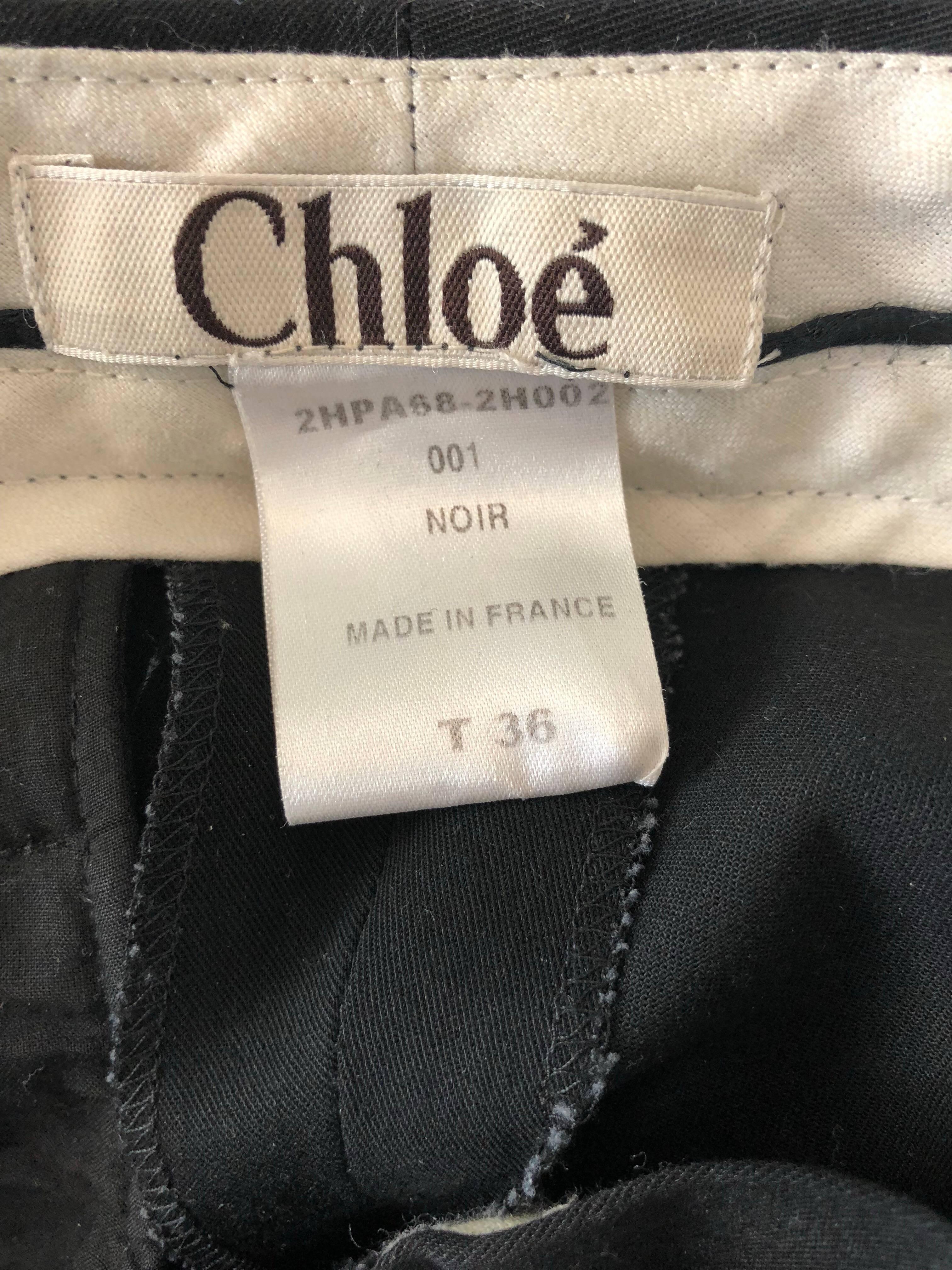 Classic and collectible for CHLOE black silk flared leg low rise trousers! Soft sturdy silk that holds shape nicely. Tailored fit, with a wider flare leg. Sits low on the hips, with button closure at waistband and zipper fly. Pockets at each side of