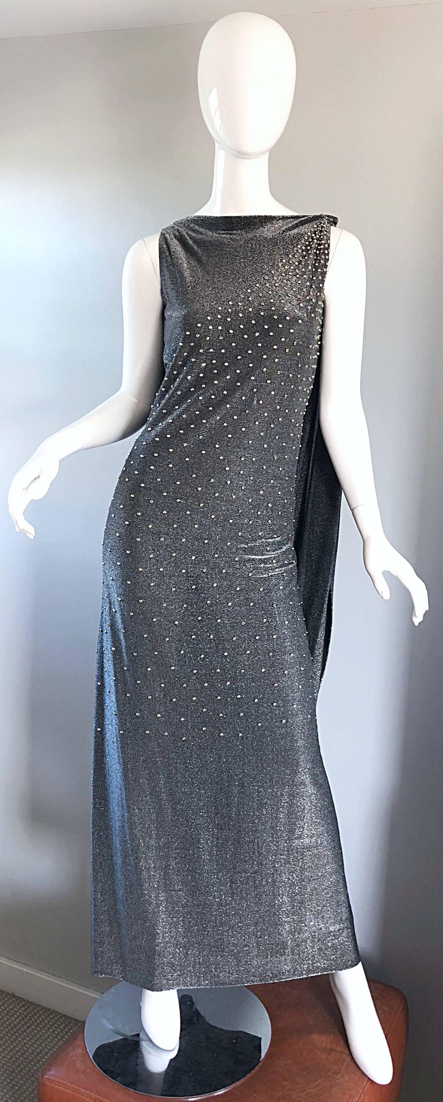 Rare Musuem Worthy 60s GEOFFREY BEENE Couture gunmetal + silver metallic silk lurex caped evening dress! Luxurioussoft (not scratchy at all) silk lurex fabric. Features hundreds of hand-sewn silver metal studs and rhinestones on the front. Attached