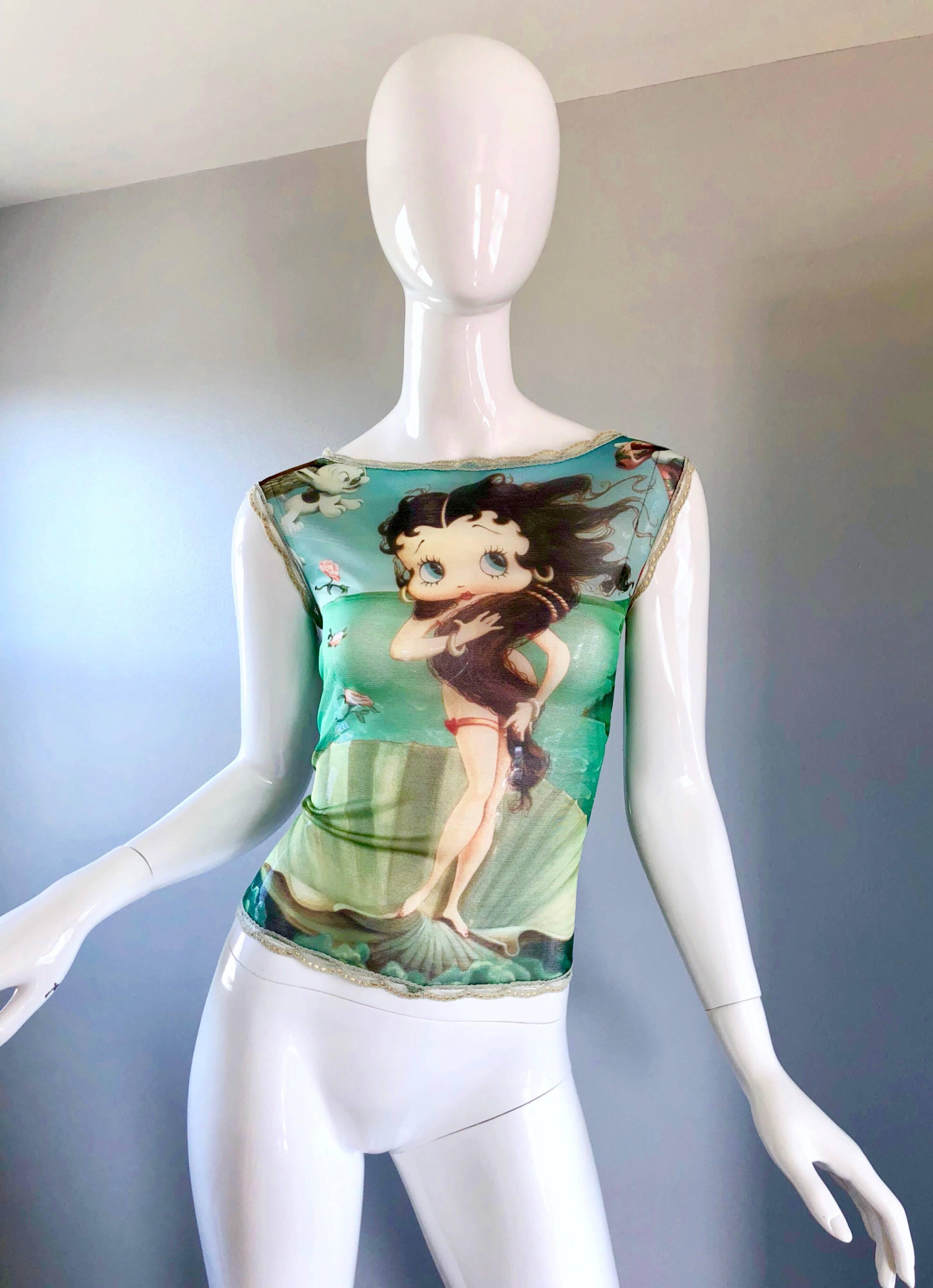Extremely rare and collectible 1990s ELETRA CASADEI 
Betty Boop, "Birth of Venus' novelty semi sheer cap sleeve blouse! Features a classic print, with a novelty twist. Features a muted green lace trim along the neck, arms, and down the center