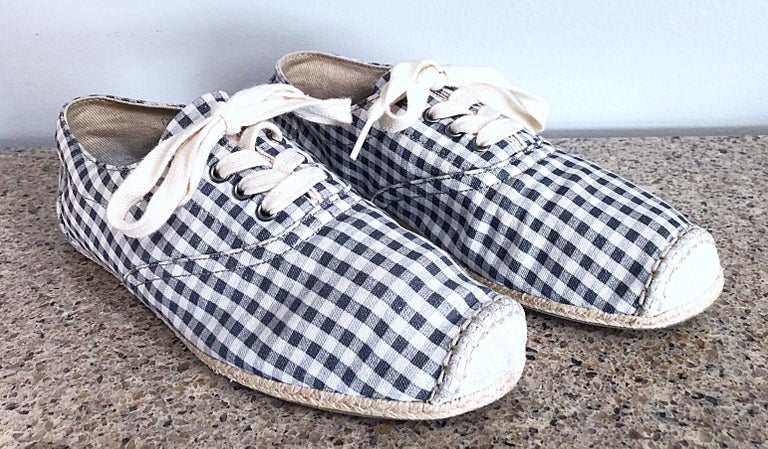Brand new rare, never worn men's DOLCE AND GABBANA grey and ivory checkered espadrille lace-up shoes! Features an allover gray and white gingham / checker print, with ivory cotton laces. Suede tip, with sued D&G logo appliqué at back of each shoe.