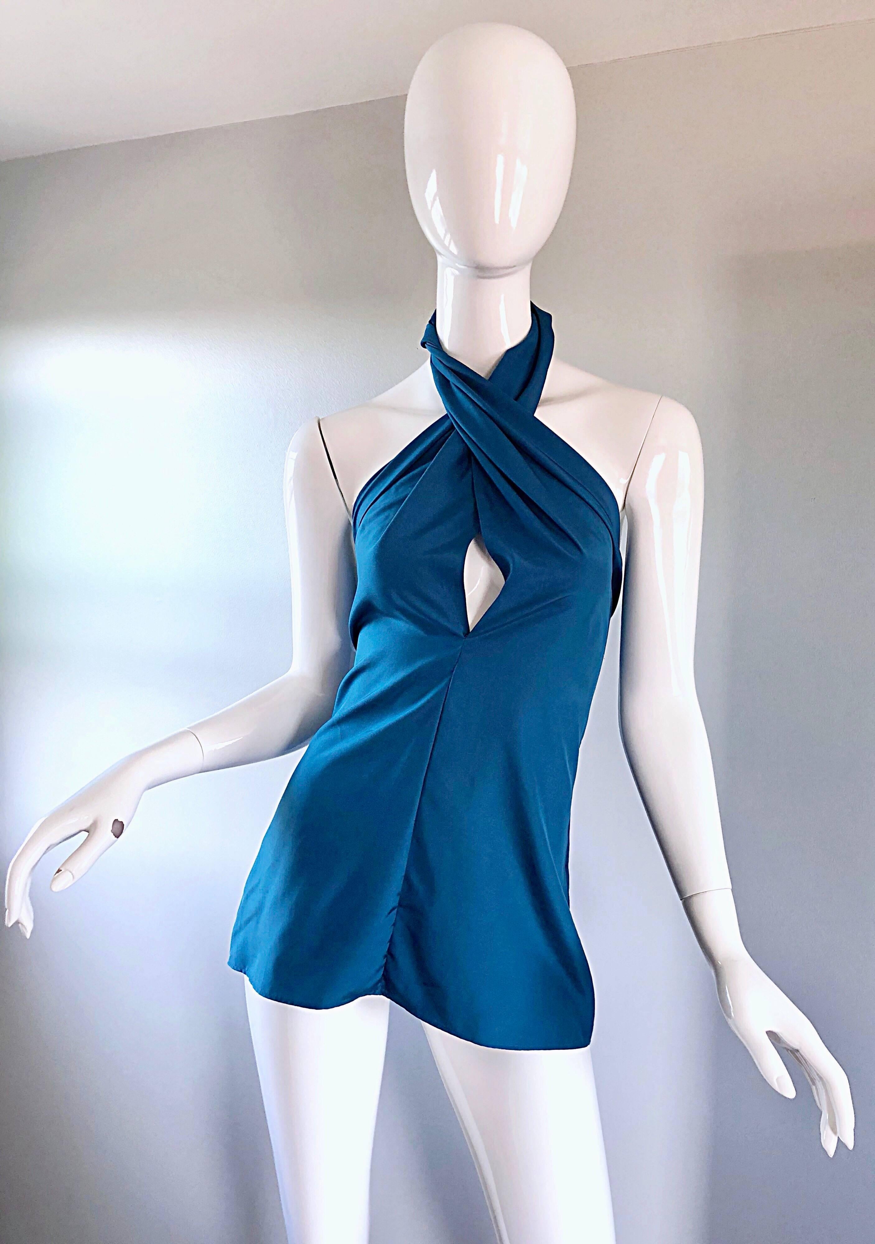 New with tags YVES SAINT LAURENT 'Rive Gauche" Spring / Summer 2012 blue silk halter top! Sexy plunge with a perfectly tailored bodice. Hidden zipper up the side with hook-and-eye closure. Can easily be dressed up or down, belted or alone.