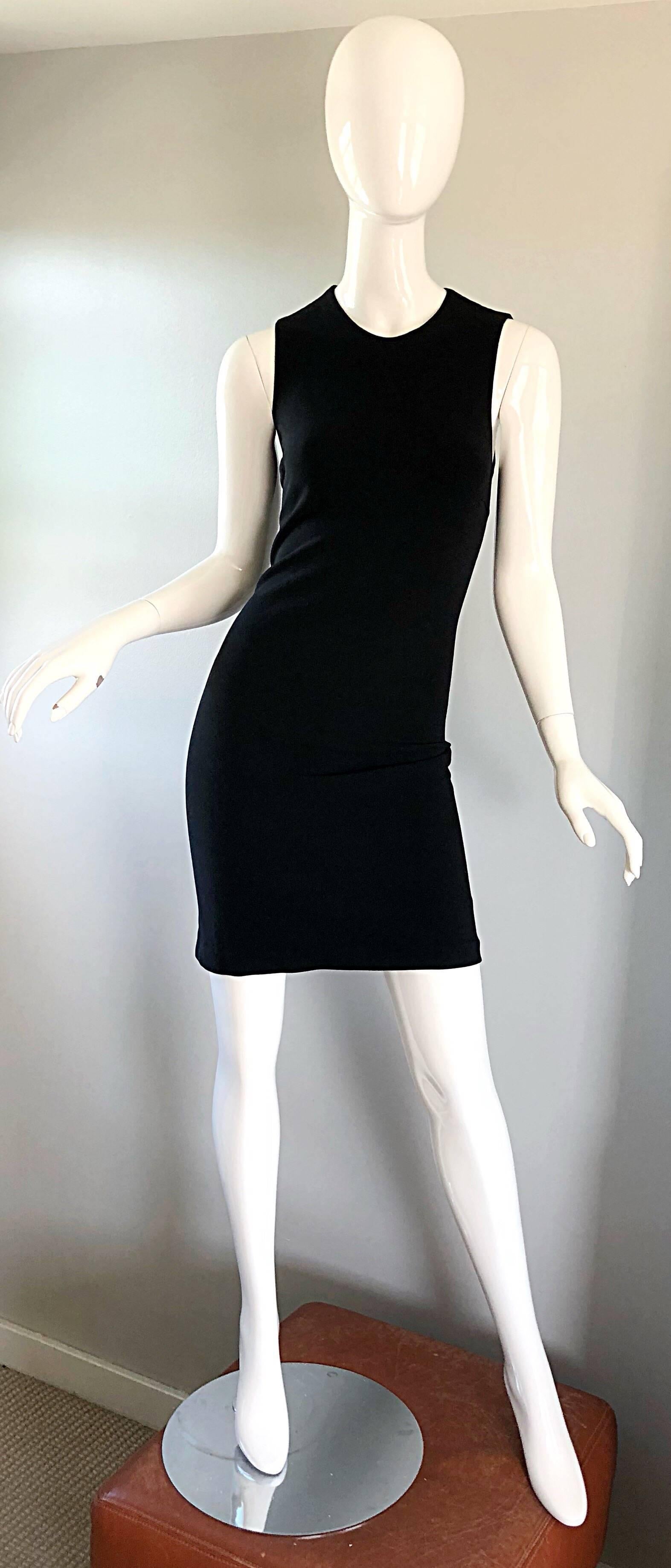 Classic, sophisticated, yet sexy MICHAEL KORS COLLECTION black wool bodcon dress! Any woman who has ever owned a MK Collection dress is well aware at the wonders his dresses do for the body. Hidden zipper up the back with hook-and-eye closure.