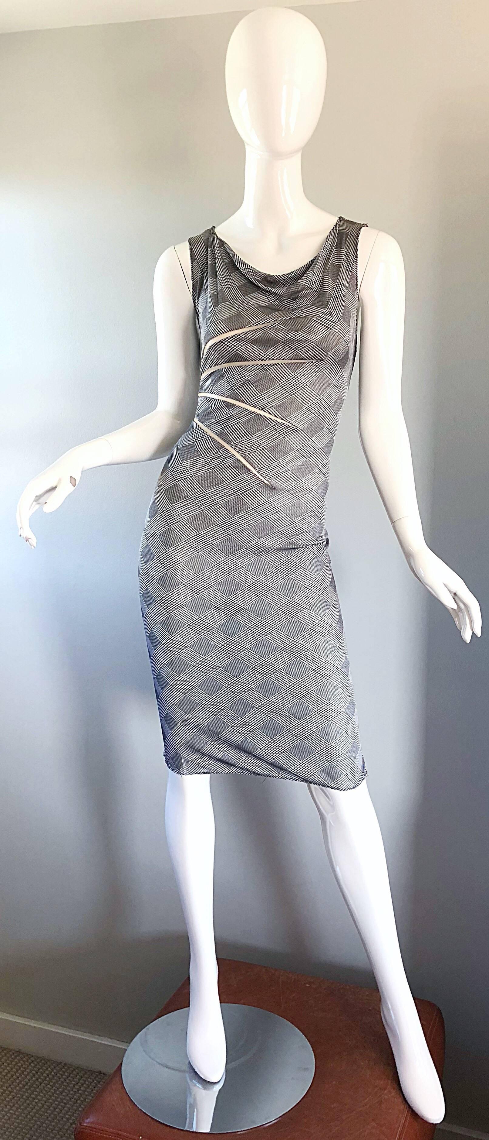 Rare and collectible vintage GIANNI VERSACE COUTURE 
Spring / Summer 1998 black and white houndstooth dress! Sheer cut-out details at the side bodice on the front and back of this 1990s dress. Features a body hugging silk jersey that stretches to