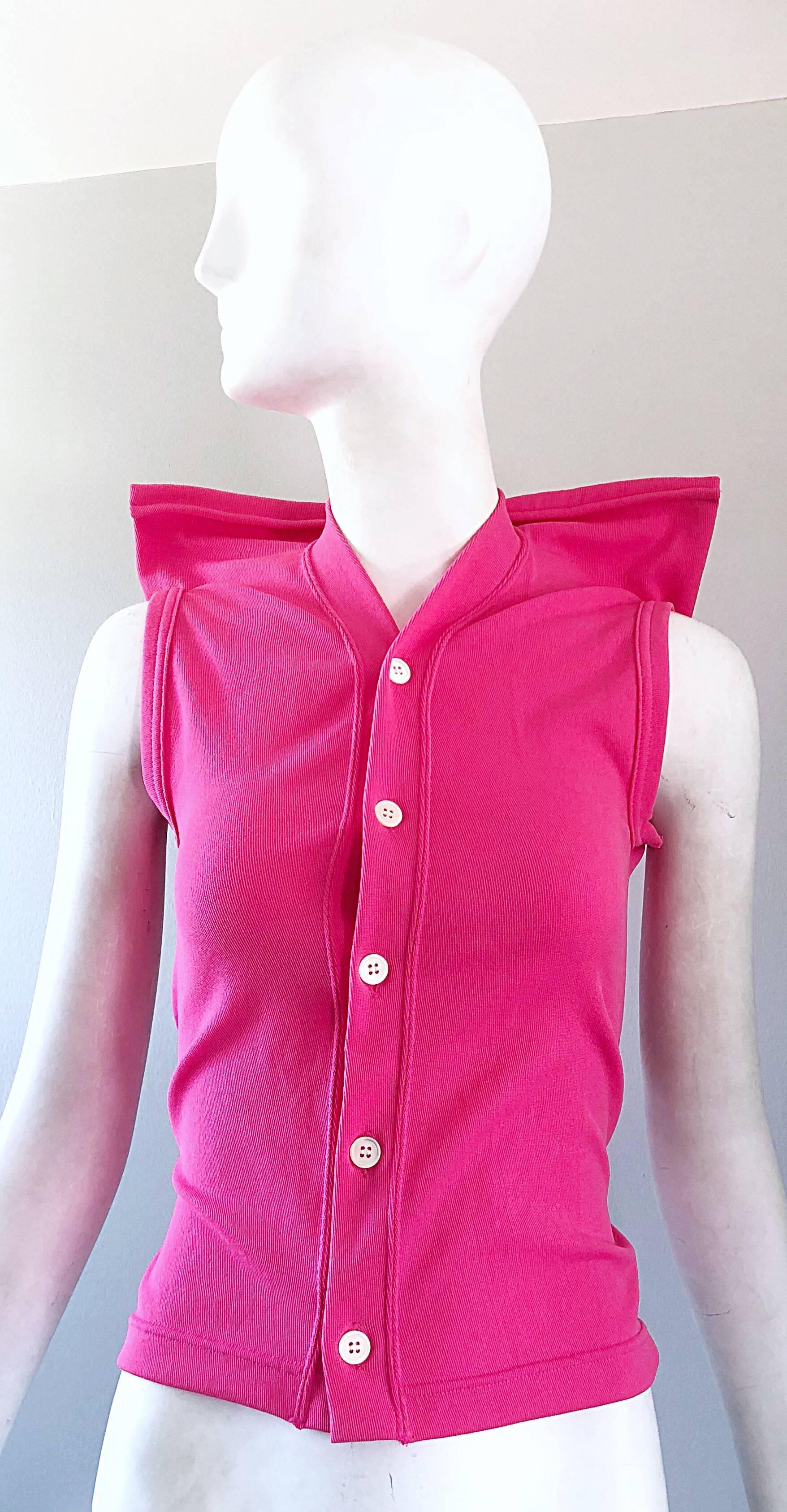 Rare 90s COMME DES GARCONS hot pink futuristic Avant Garde sleeveless knit top! Features raised 'strong shoulders' that add (good) drama to any outfit. Buttons up the front. Great with a skirt, shorts, trousers, or jeans. In great condition. Made in