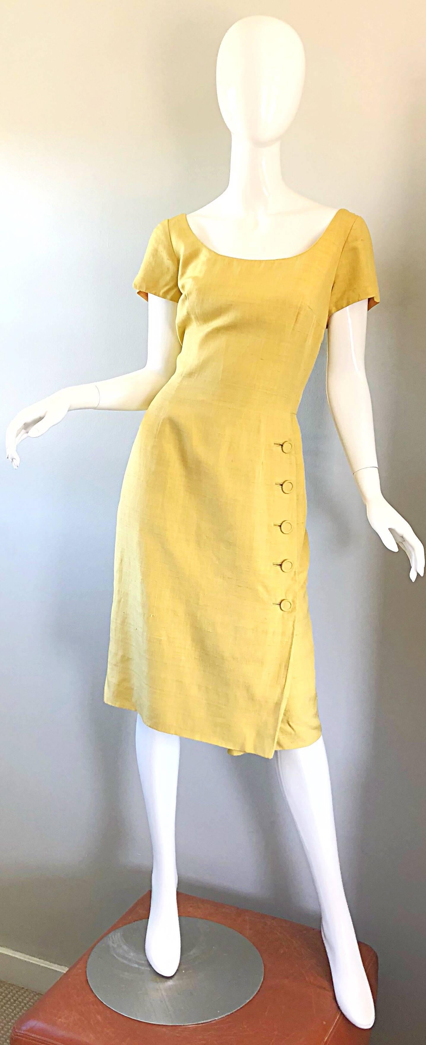 Beautiful 1950s MR. BLACKWELL mustard yellow raw silk shantung short sleeve wiggle dress! Wonder form fitting bodice features a full metal zipper up the back, with hook-and-eye closure and a pre-tied bow above that. Skirt features five silk covered