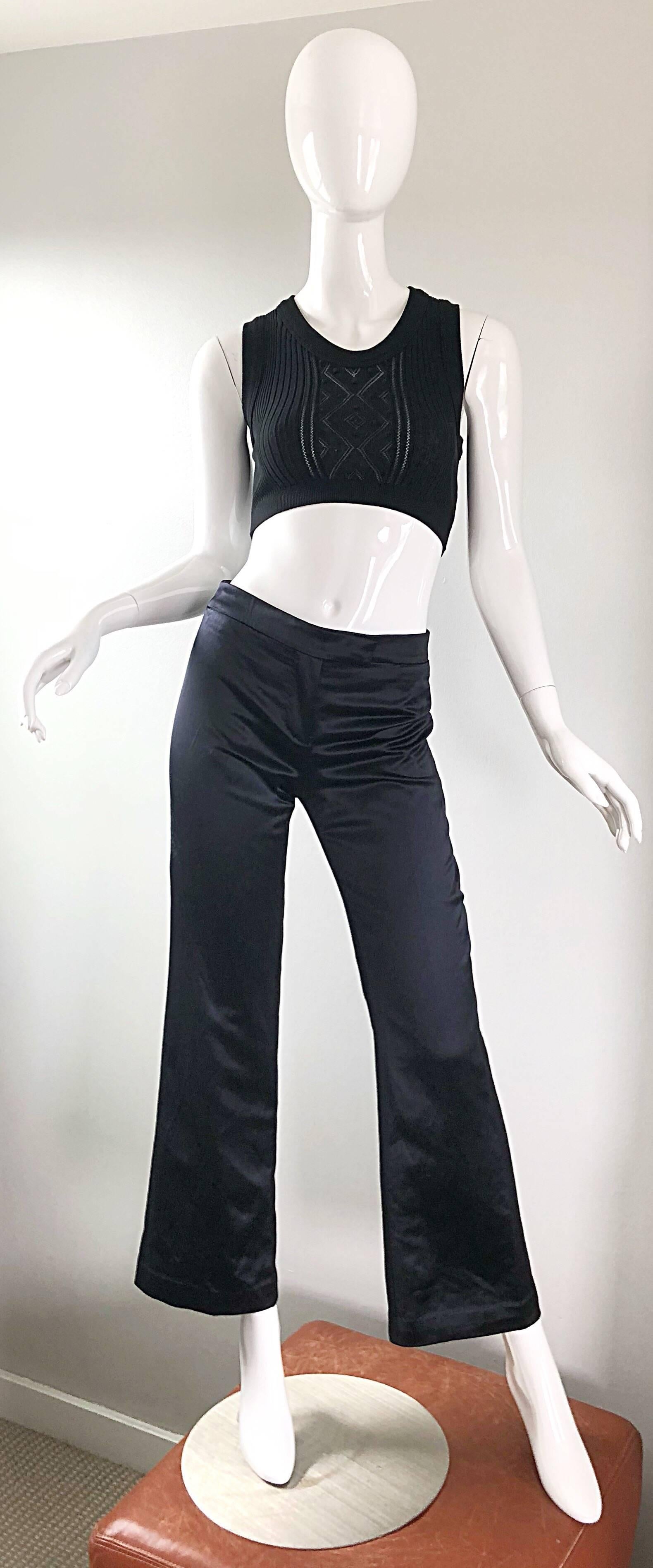 Wonderful early 2000s ALEXANDER MCQUEEN black silk sating high waist wide leg trousers! Super flattering fit, and not your basic black pants! Tailored slim fit with flared leg openings. Zipper fly with interior button closure at waistband and