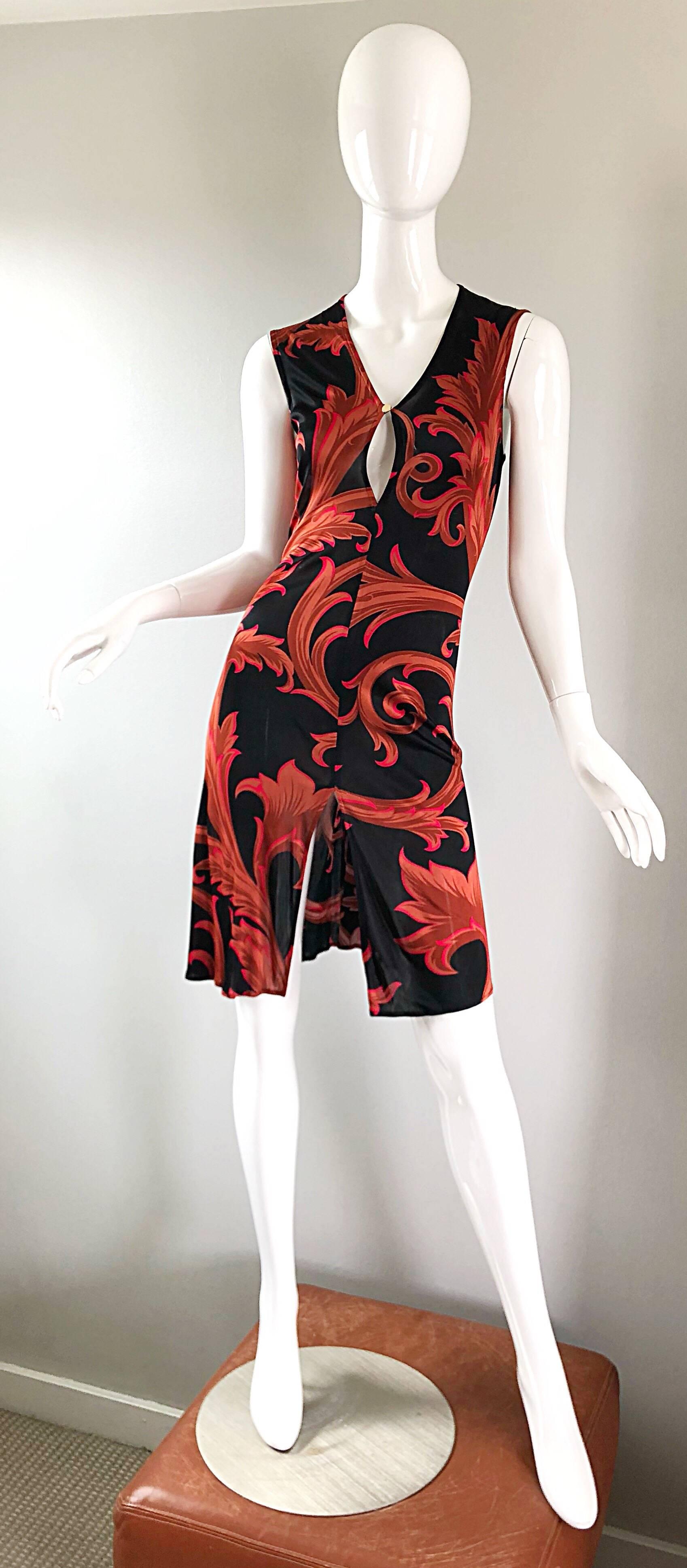 Rare early 1990s GIANNI VERSACE COUTURE red and black baroque print Asian inspired jersey dress! Features classic Versace baroque prints in vibrant colors of red, with pops of fuchsia throughout. Keyhole peek-a-boo at center bust with a gold Medusa