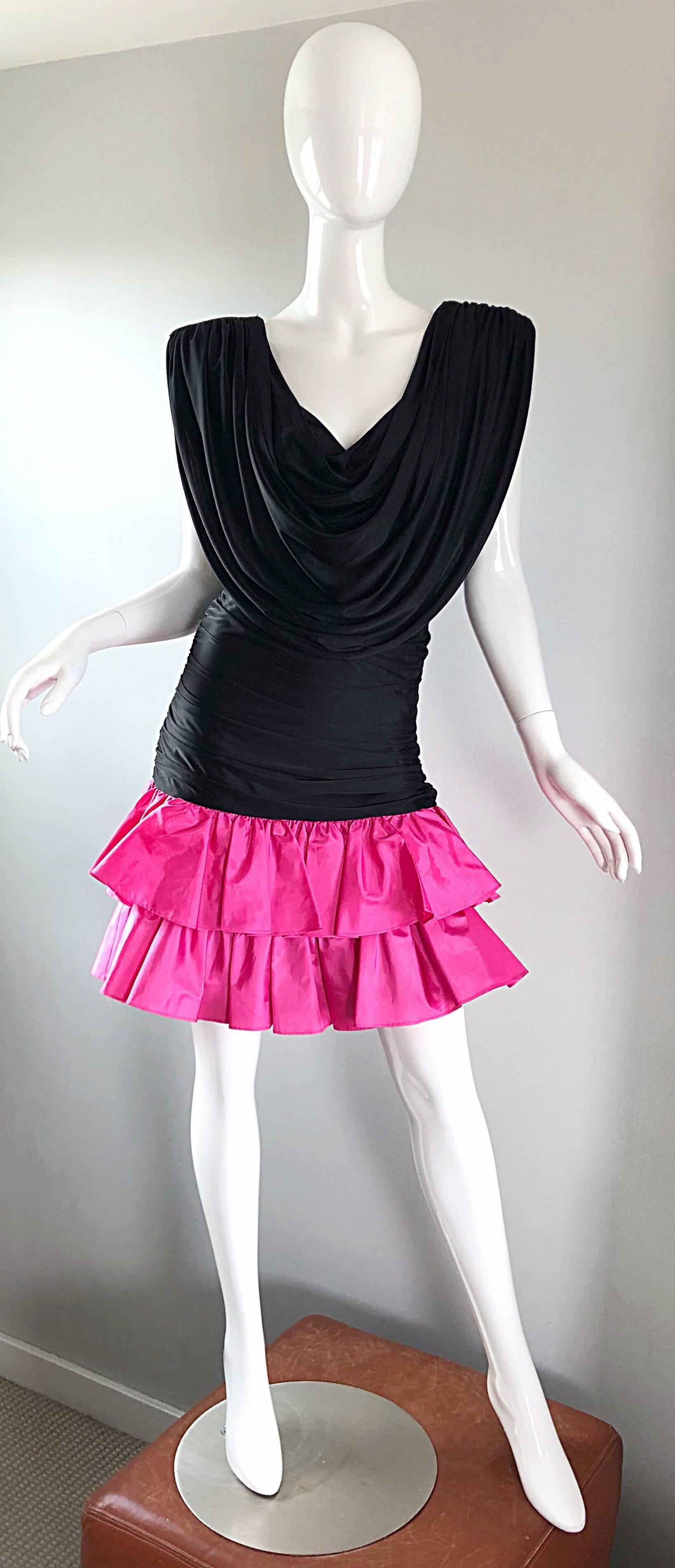 Bring back the 80s in this amazing little number! Flattering black jersey bodice stretches to fit, with strong shoulders (shoulder pads are built in, but can easily be snipped out). Flirty double layered hot pink taffeta ruffles. Strap at top back
