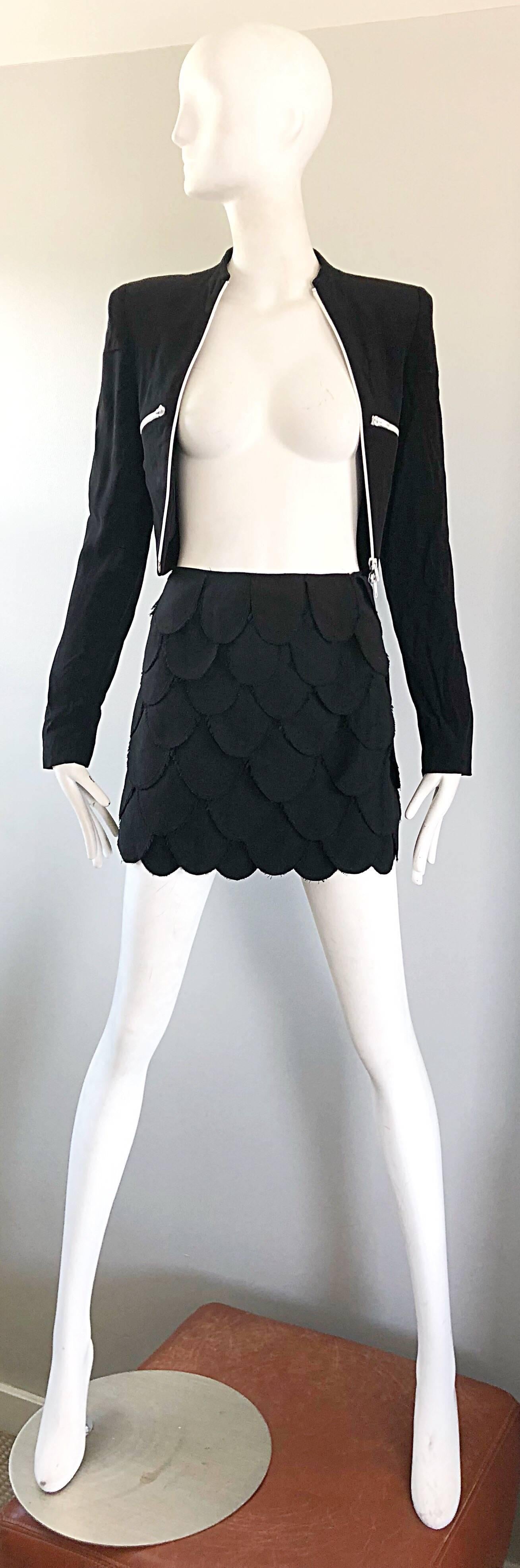 Sexy 1990s MOSCHINO CHEAP & CHIC black carwash petal fringed mini skirt! Features oval shaped panels throughout the entire front and back of the skirt. Hidden zipper up the side with hidden snap closures. The pictured 90s RIFAT FUTURE OZBEK cropped