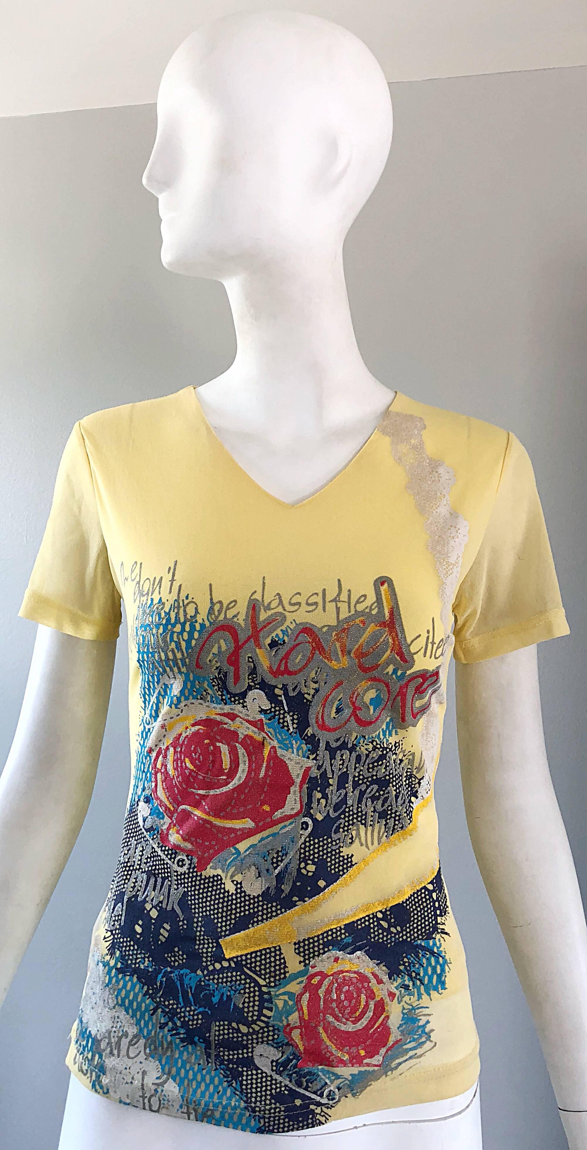 Awesome 90s MAX NUGUS HAUTE COUTURE pale yellow double layered mesh short sleeve v-neck shirt! Features graffiti prints in red, teal and navy blue. Has a Jean Paul Gaultier vibe to it! 
In great unworn condition.
Made in USA
Approximately SIze Small