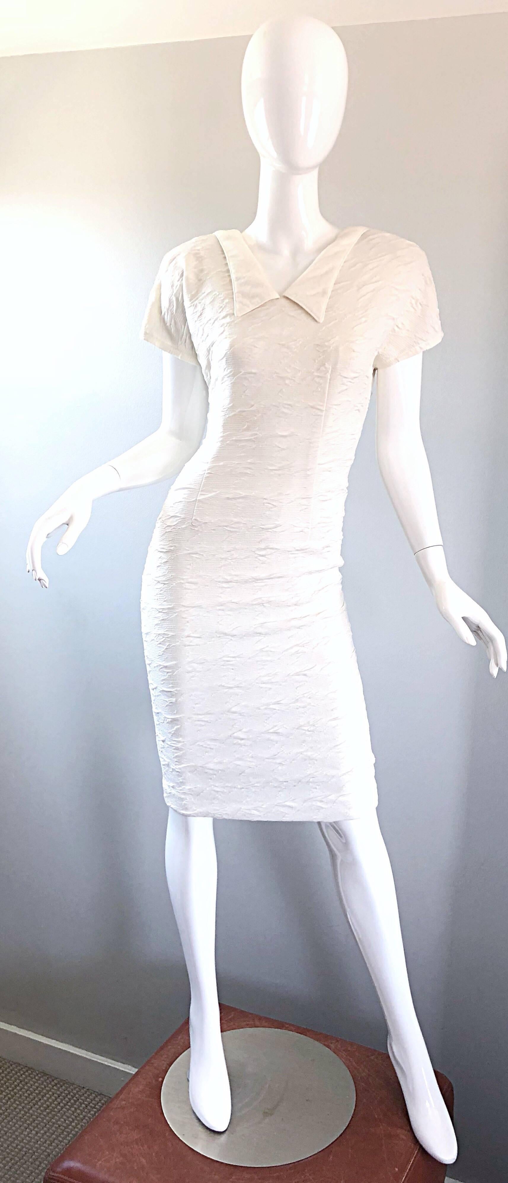 Sexy early 90s LA KUCCI white bodycon French dress! Features a soft textured rayon jersey that stretches to fit. Avant Garde style with a mock collar and strong shoulders (with shoulder pads). Hidden zipper up the back with hook-and-eye closure.
