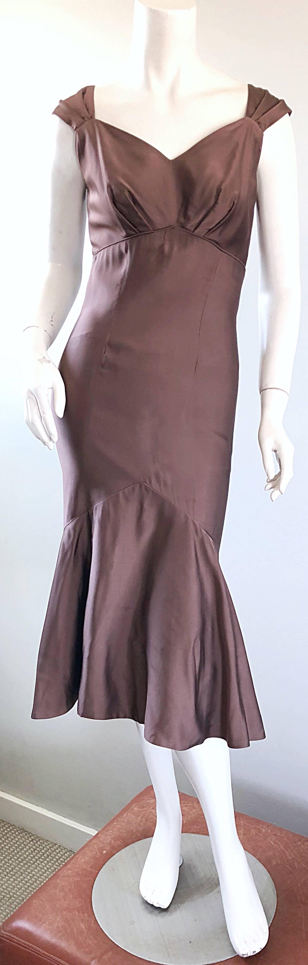 Gorgeous 1950 HALMAR demi couture taupe / light brown silk mermaid hem cocktail dress! Features a tailored fitted bodice and body, with a remarkable flared hem. Hem features an attached interior crinoline for extra flare. Sweetheart neckline with