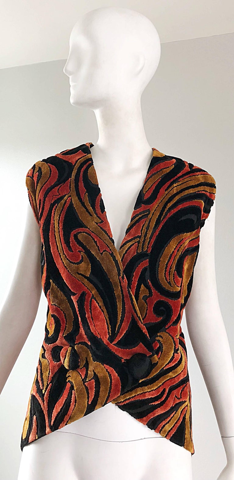 Rare 1950s EISENBERG soft chenille larger size double breasted sleeveless vest! Warm vibrant hues of burnt orange, brown and black. Shorter in the front, with a longer tail in the back. Fabric covered buttons on the front. Fully lined. Wear this