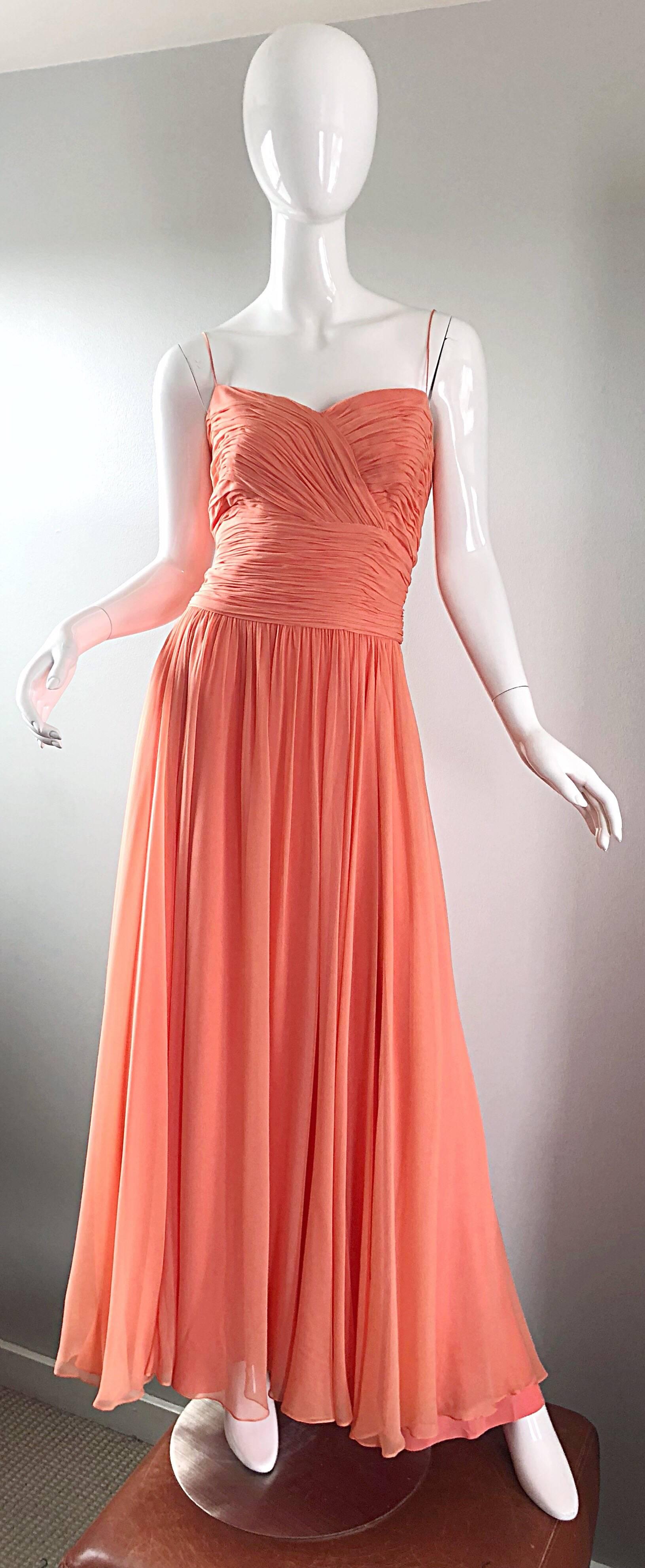 Gorgeous 1950s SAKS 5th AVENUE salmon, coral pink silk chiffon demi couture gown! Words cannot even begin to describe the quality, construction, color and design of this masterpiece! Flattering ruched bodice with thin spaghetti straps. Layers and