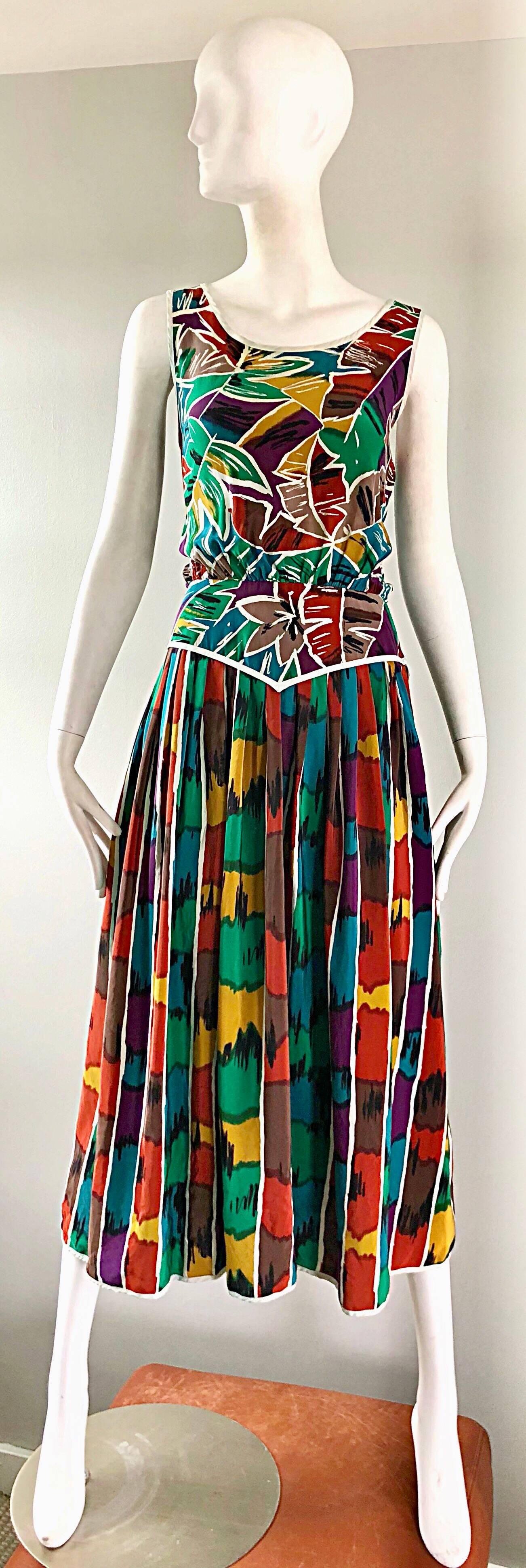 Chic vintage Oscar de la Renta MISS O kaleidoscope / Ikat tropical print silk midi dress! Features a flattering tailored bodice, with a loose fitting forgiving full skirt. Vibrant colors of rust, kelly green, burnt orange, teal blue, purple, white