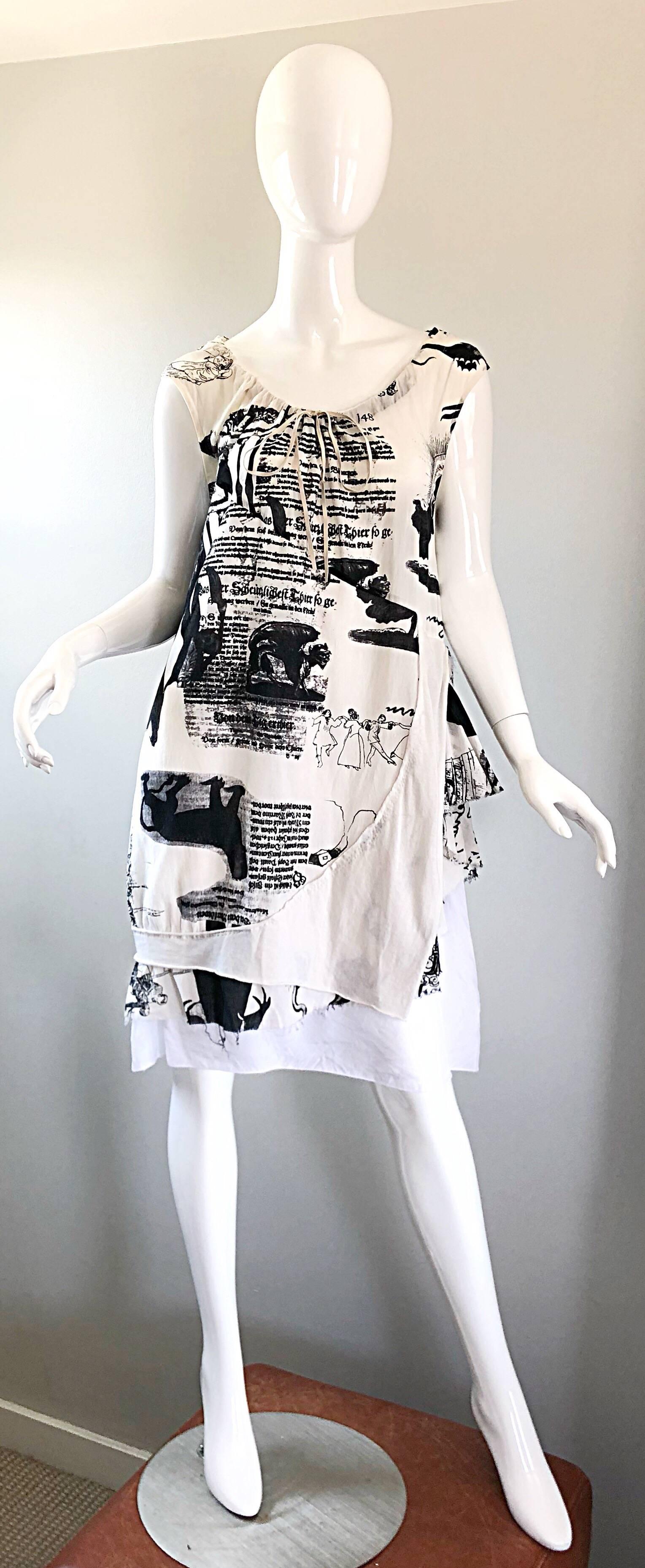 Rare vintage 56G S/S 2006 Japanese designer black and white newspaper / novelty print cotton sac dress! Features prints of newspaper / book clipping, gargoyles, and dancing witches. Suede leather ties at neck. Simply slips over the head. Can be worn