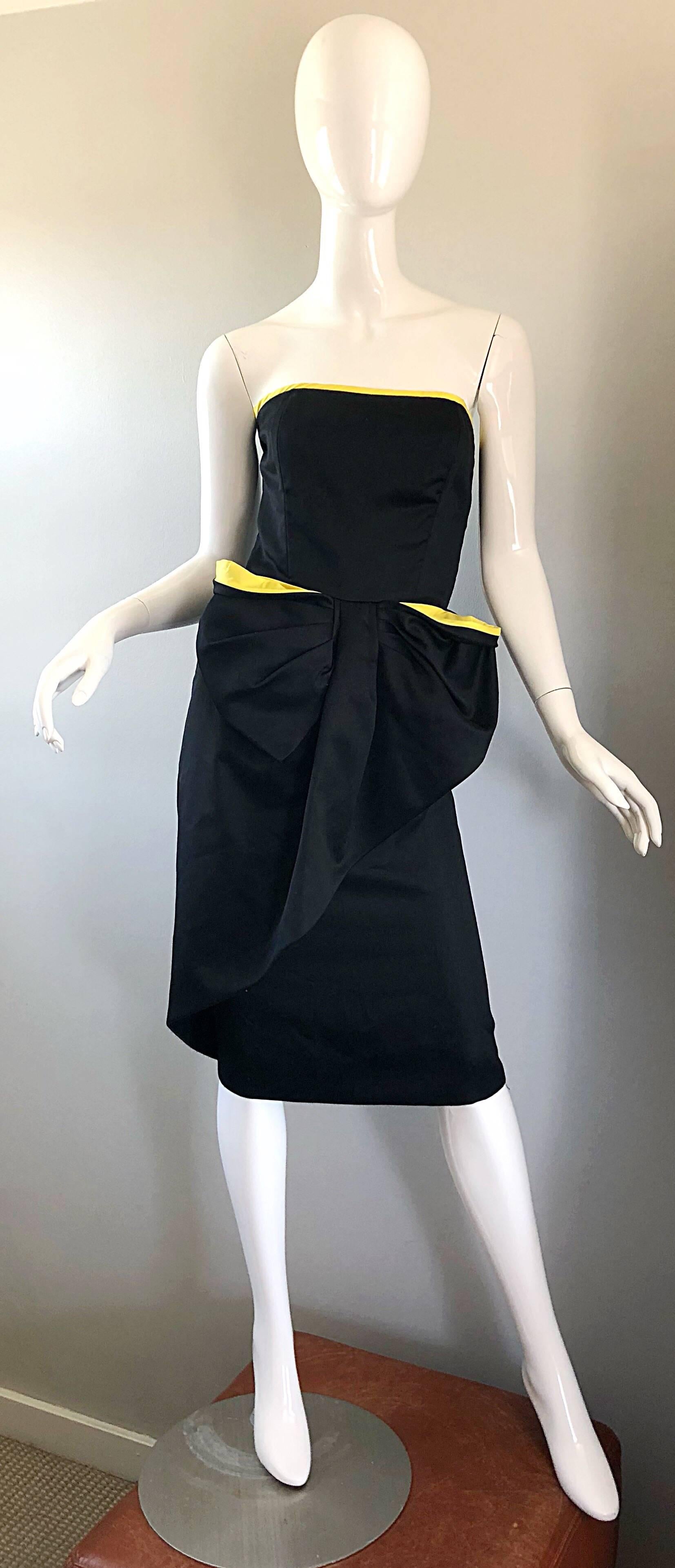 Chic late 80s VICTOR COSTA black and yellow Avant Garde strapless cotton cocktail dress! Features a fitted boned bodice that is lined in canary yellow. Forgiving skirt features a large 
bow-like detail. Hidden zipper up the back with hook-and-eye