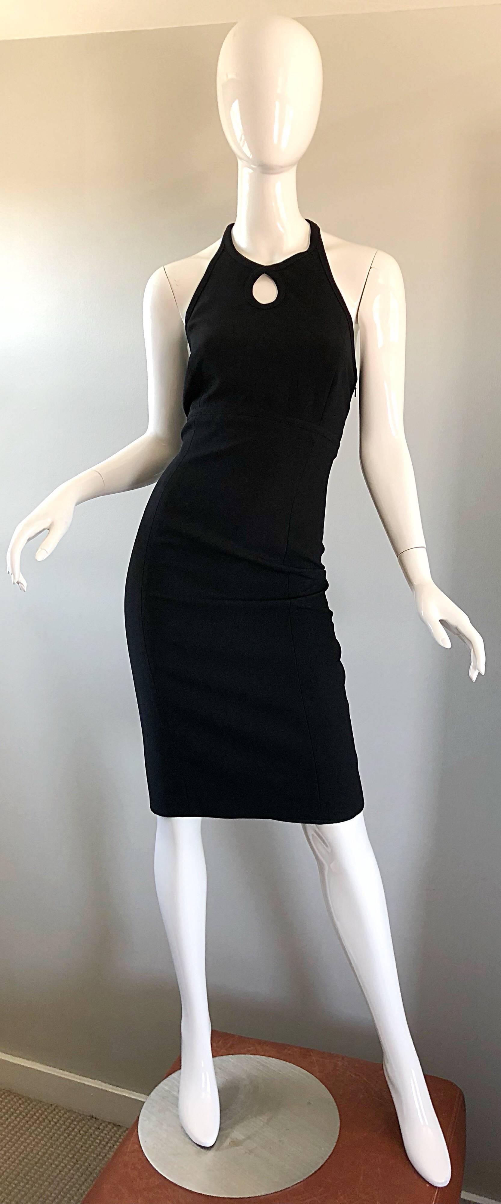This perfect vintage little black dress was designed by none other than BILL BLASS! Features a flattering fit that has some stretch. Keyhole detail above the bust. Racer back design reveals just the right amount of back. Hidden zipper up the back